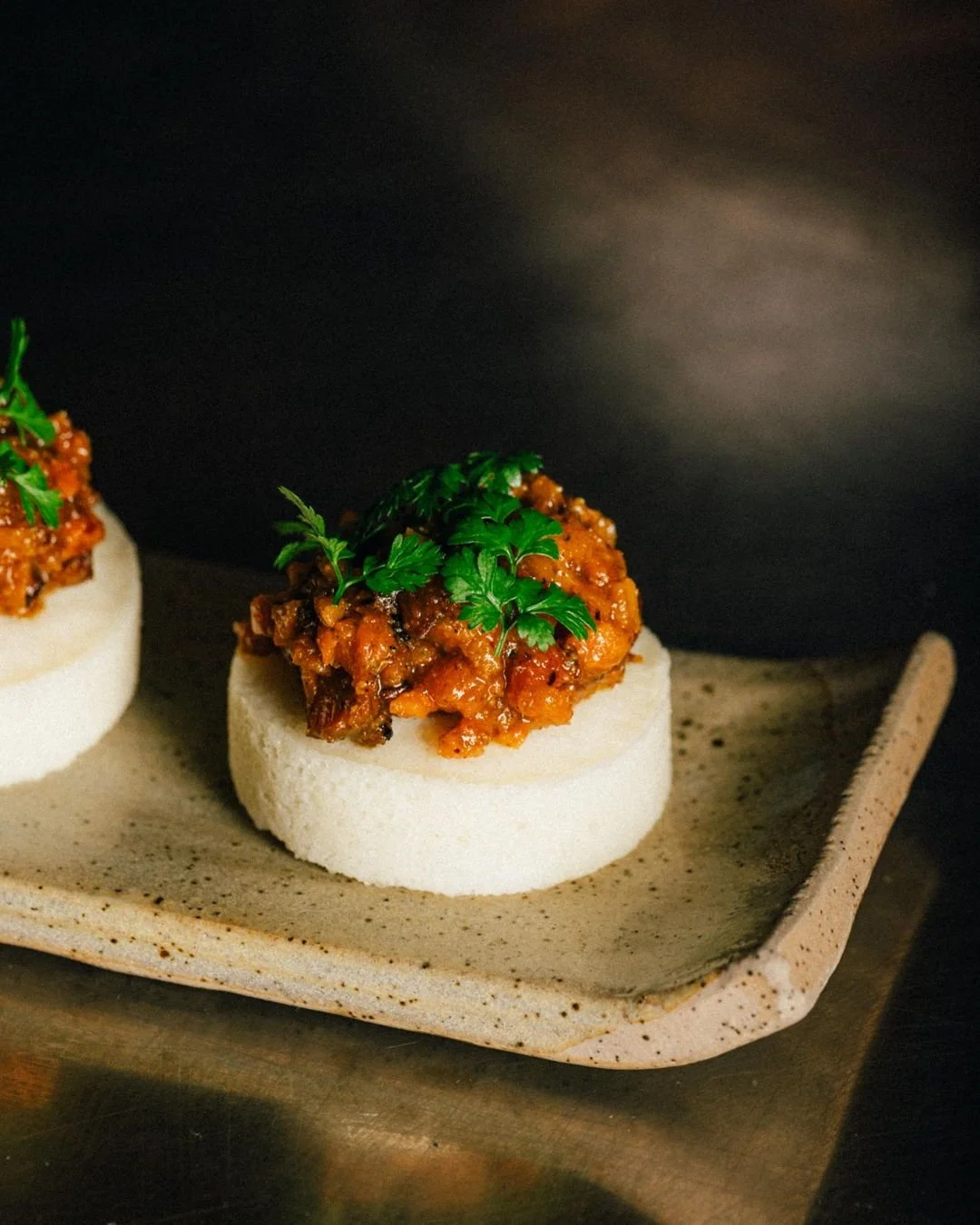Idli is a fermented steamed rice cake, usually paired with chutney, sambar and milagai podi — a spiced lentil powder which is often utilised as a condiment. The flavours are wonderfully perky; a spicy-sour bite that keeps the tastebuds on its t