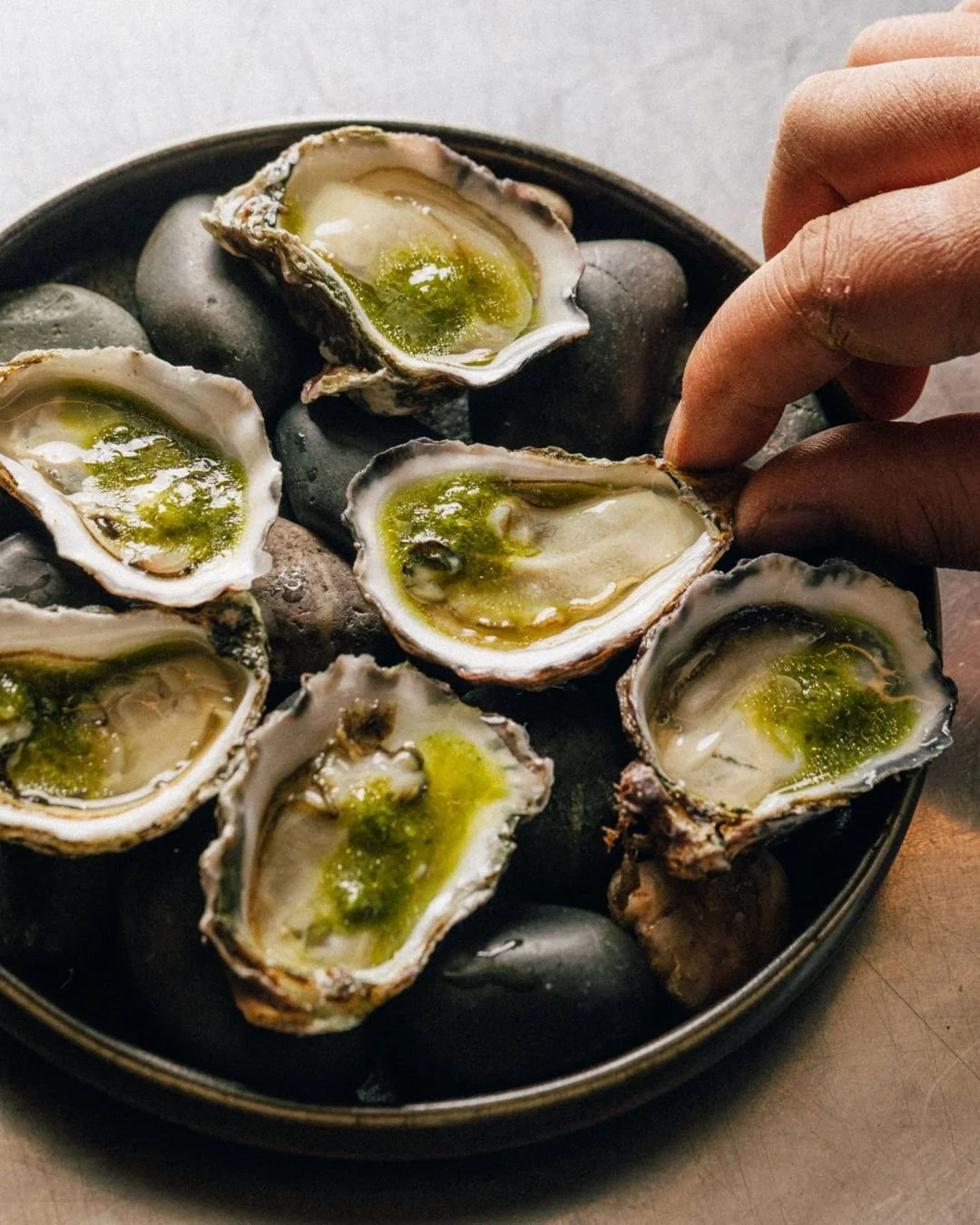 This city’s love affair with oysters knows no bounds — and for good reason. These slippery little snacks, paired with a well-chosen drink, offer a leisurely way to begin your meal. It’s no wonder nearly every venue has them on the m