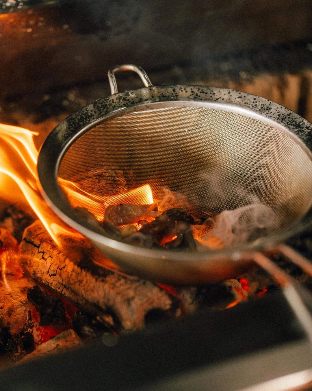 In our kitchen, fire isn’t just for cooking — it’s an ingredient in its own right. We char and barbecue only a select few seasonal ingredients that truly come alive over the tease of smoke and flames.