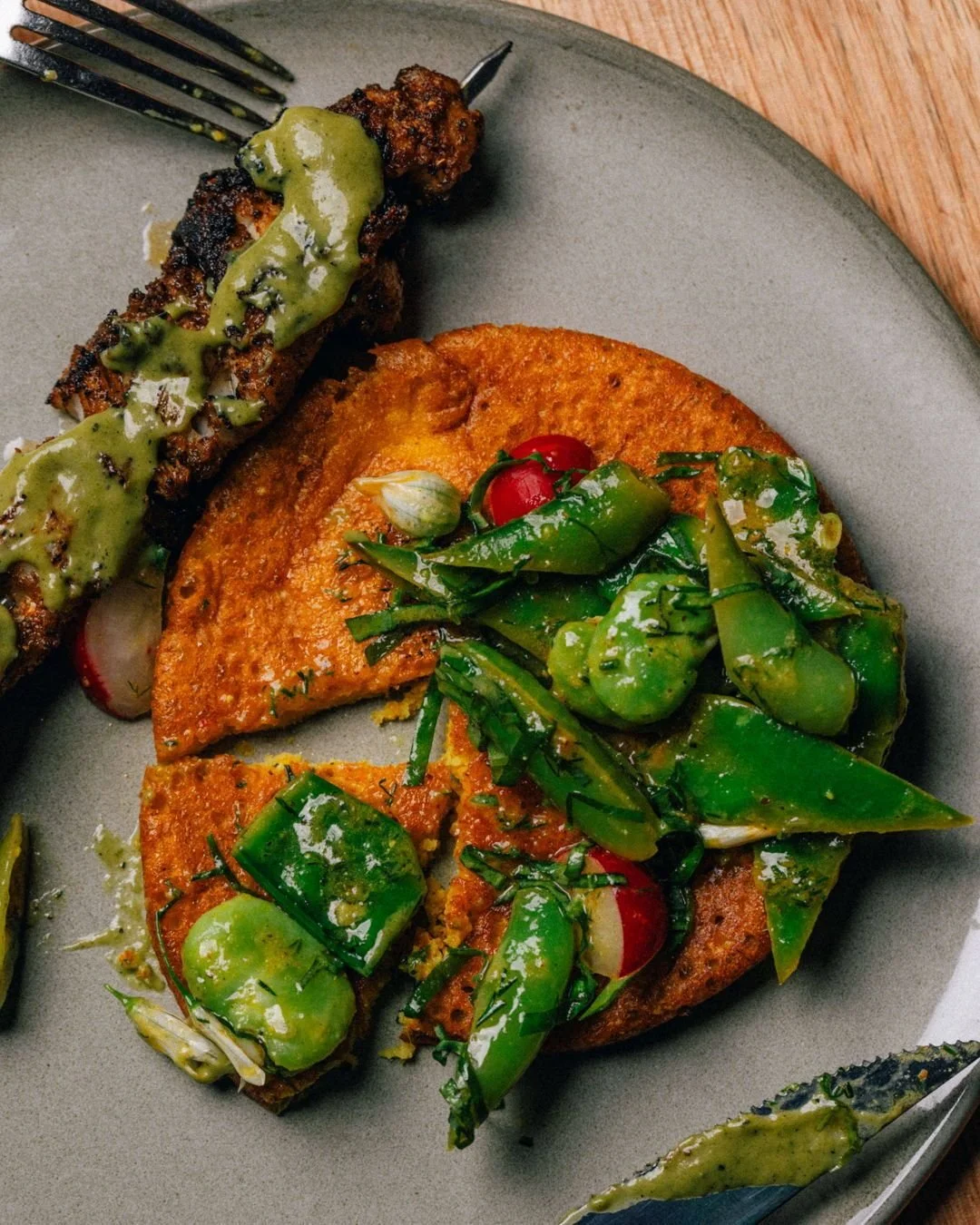 Our current middle course is a little flavour journey of its own.

The best way to enjoy it? Give the veggies a good mix, pile them onto the chila (our savoury pancake aka the vessel of our dreams), and alternate bites between the kebab and the veg.
