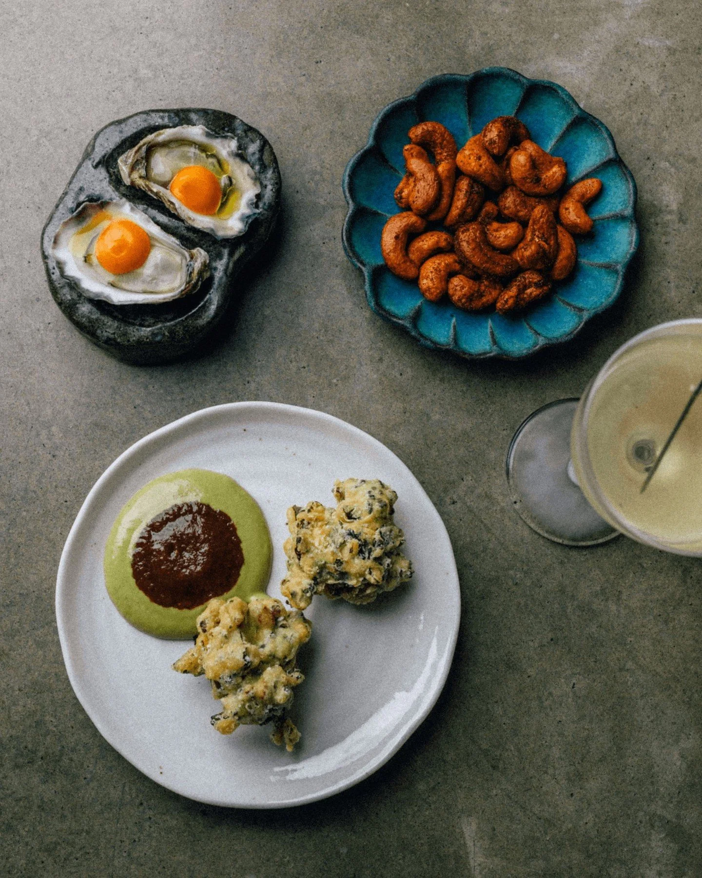 Attention, fellow snack connoisseurs! In keeping with the season, we&rsquo;ve made a few tweaks to the Summer Snack Set &mdash; the oysters now come with a brilliantly tart lime achaar, and the fritters are now of the Tropea onion persuasion, marking