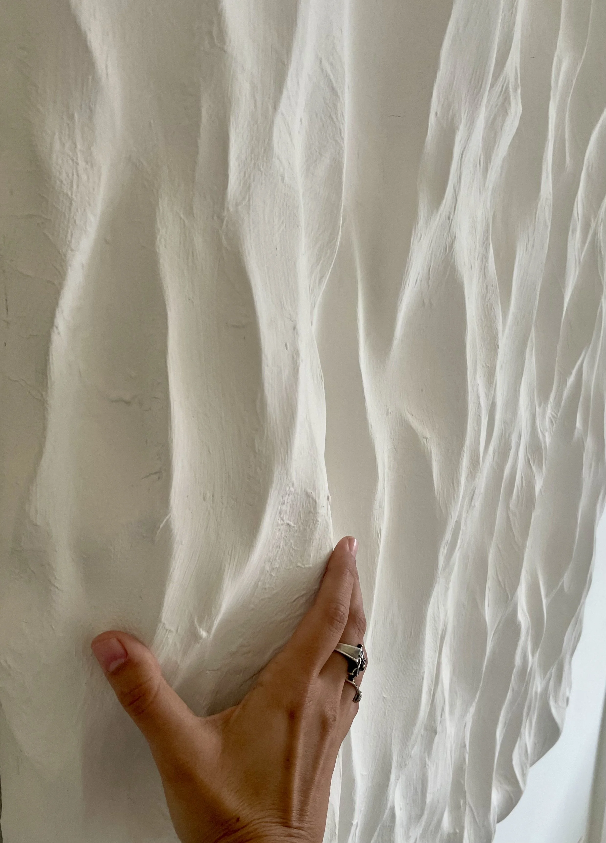 paloma-rocha-waves-textured-wall-sculpture-detail-hand.jpg