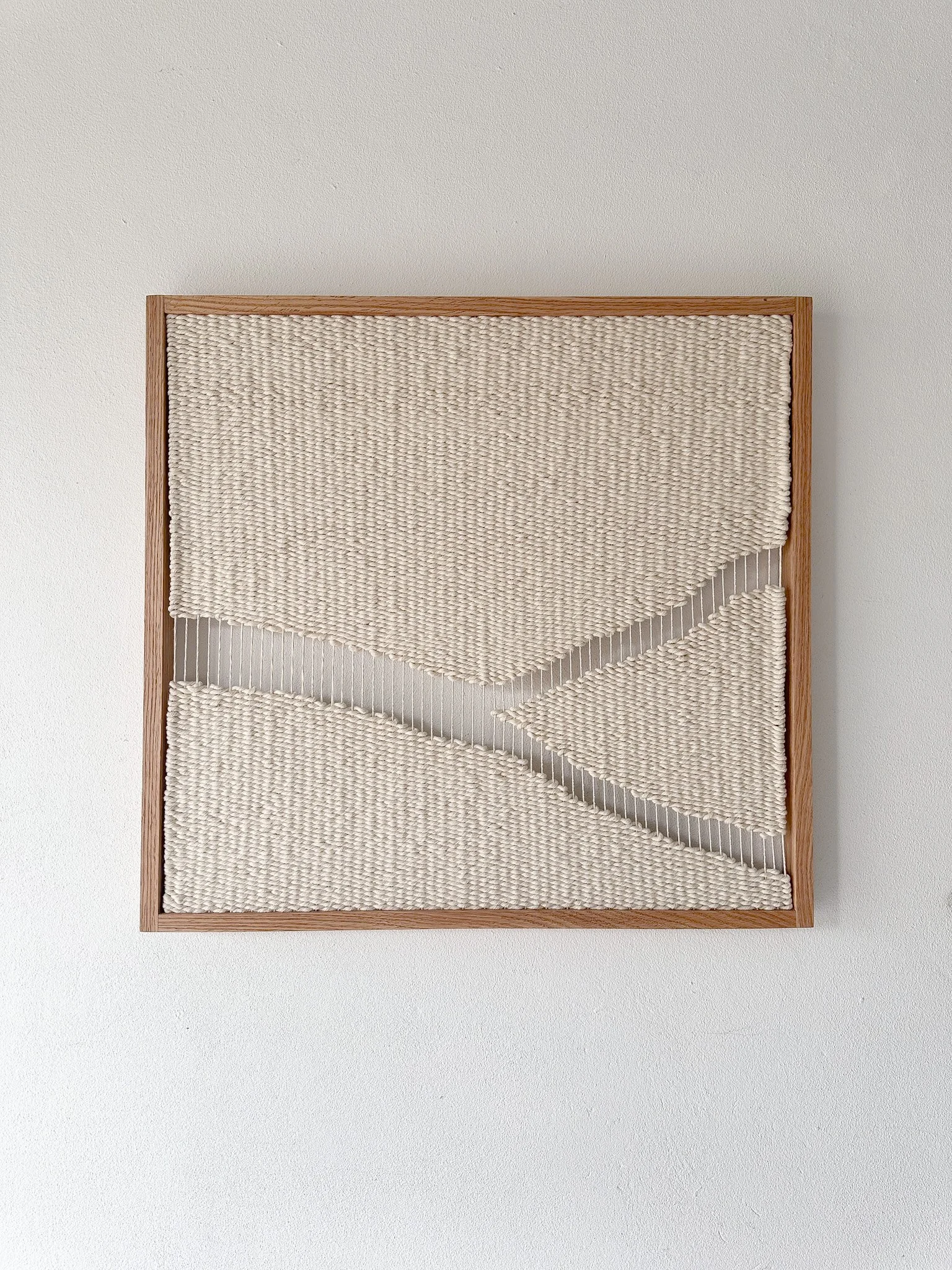 oak framed handwoven tapestry in natural cotton inspired by the kintsugi Japanese art of mending the broken | Ana Salazar Atelier