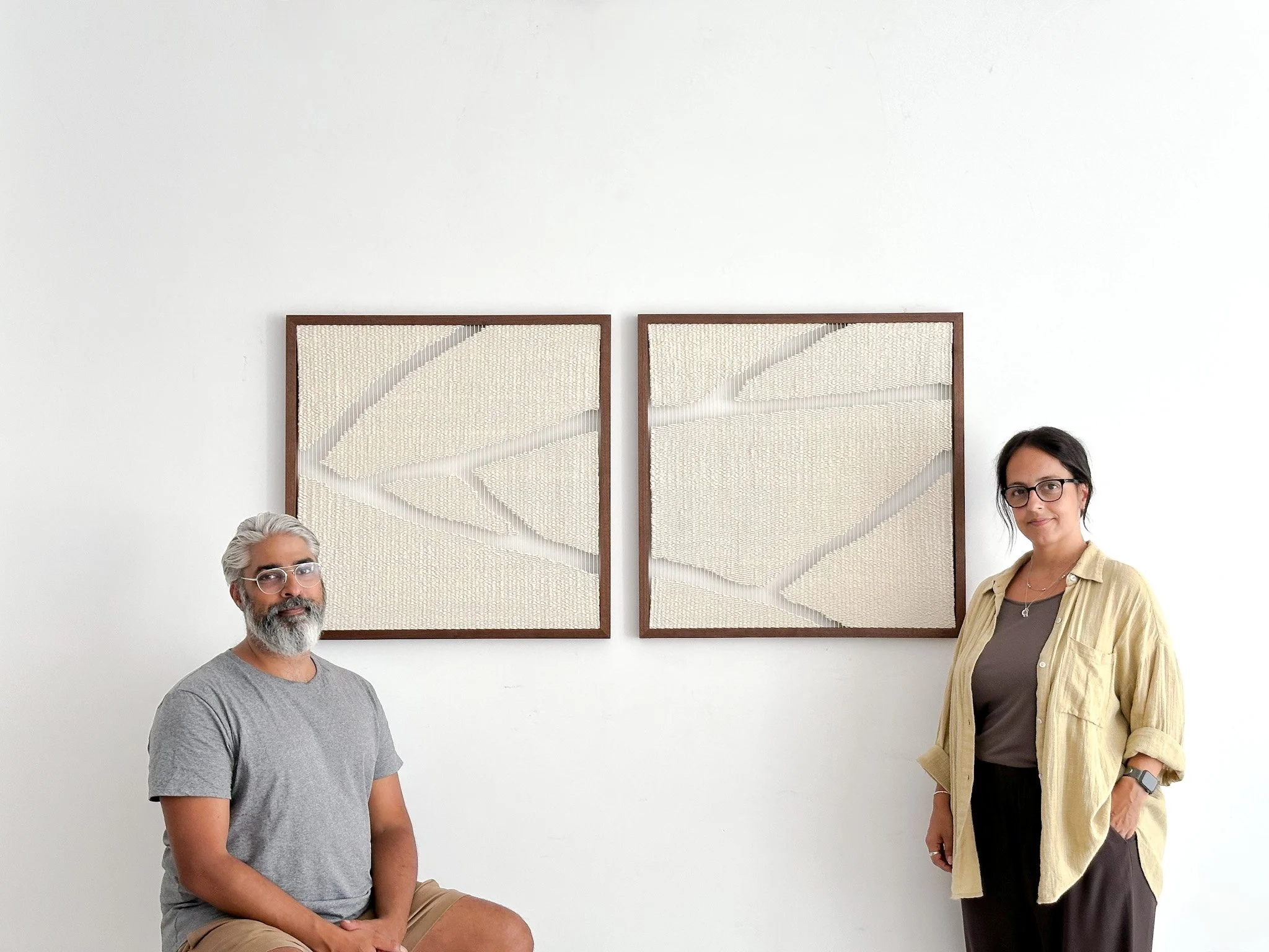 Prash Vadukul and Ana Salazar posing in front of their diptych bespoke artwork inspired by Kintsugi art.