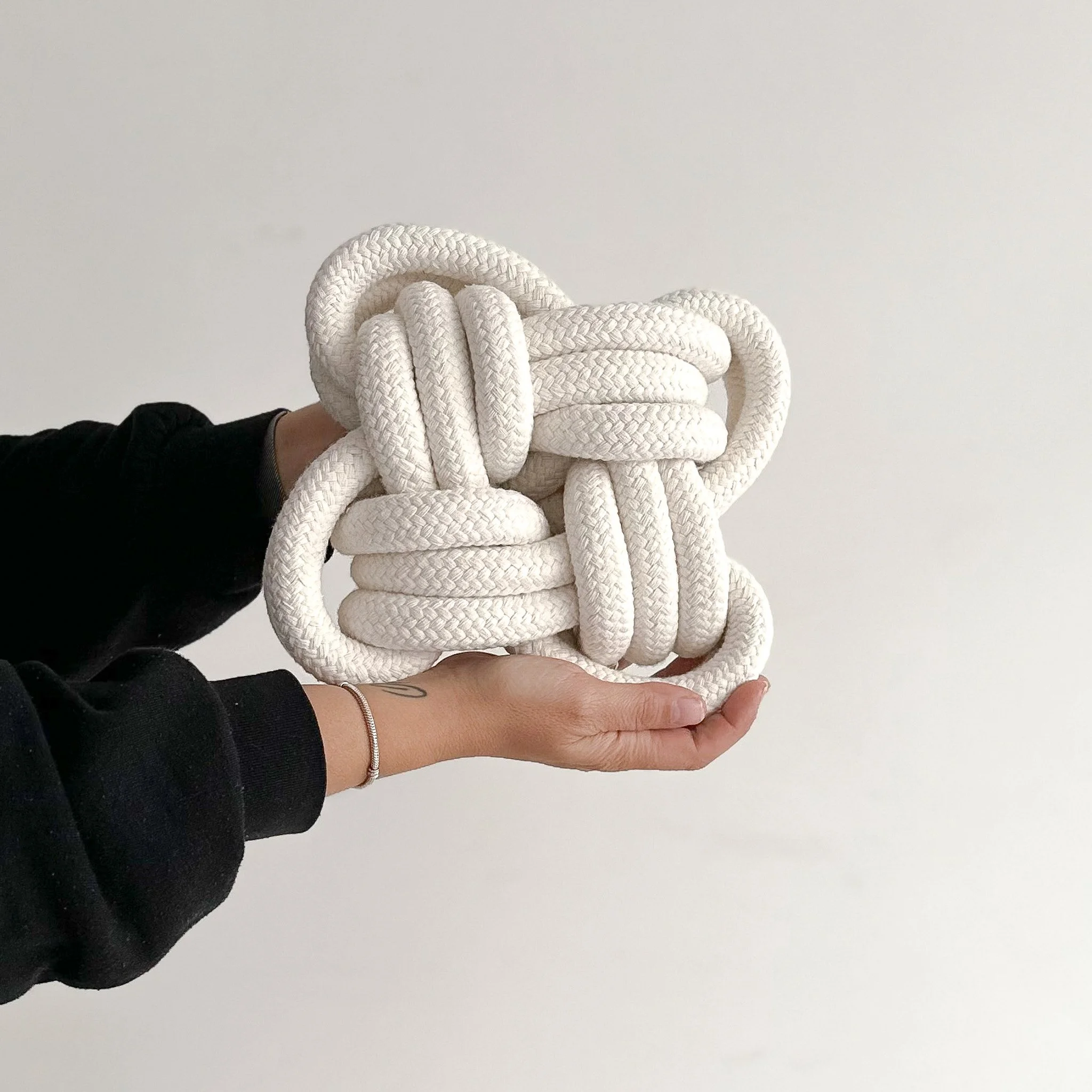 Large textile sculpture of a 5 point star knot in natural braided cotton | Ana Salazar Atelier