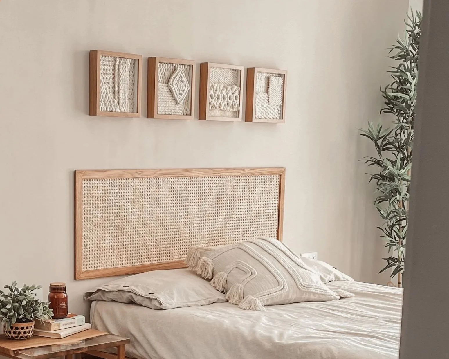 A series of framed textile artworks in oak frames creating a rhythmic gallery wall with natural fiber textures | Ana Salazar Atelier