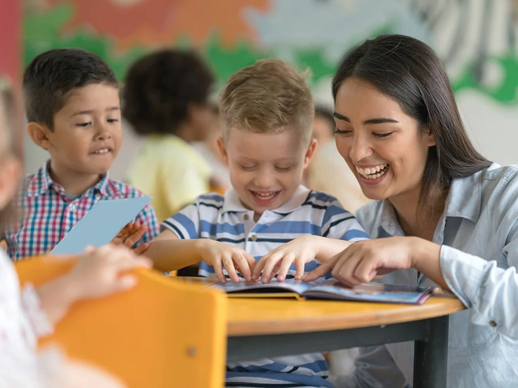 teacher-reading-with-two-young-boys.jpg
