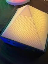 Open book with a light underneath illuminating the pages