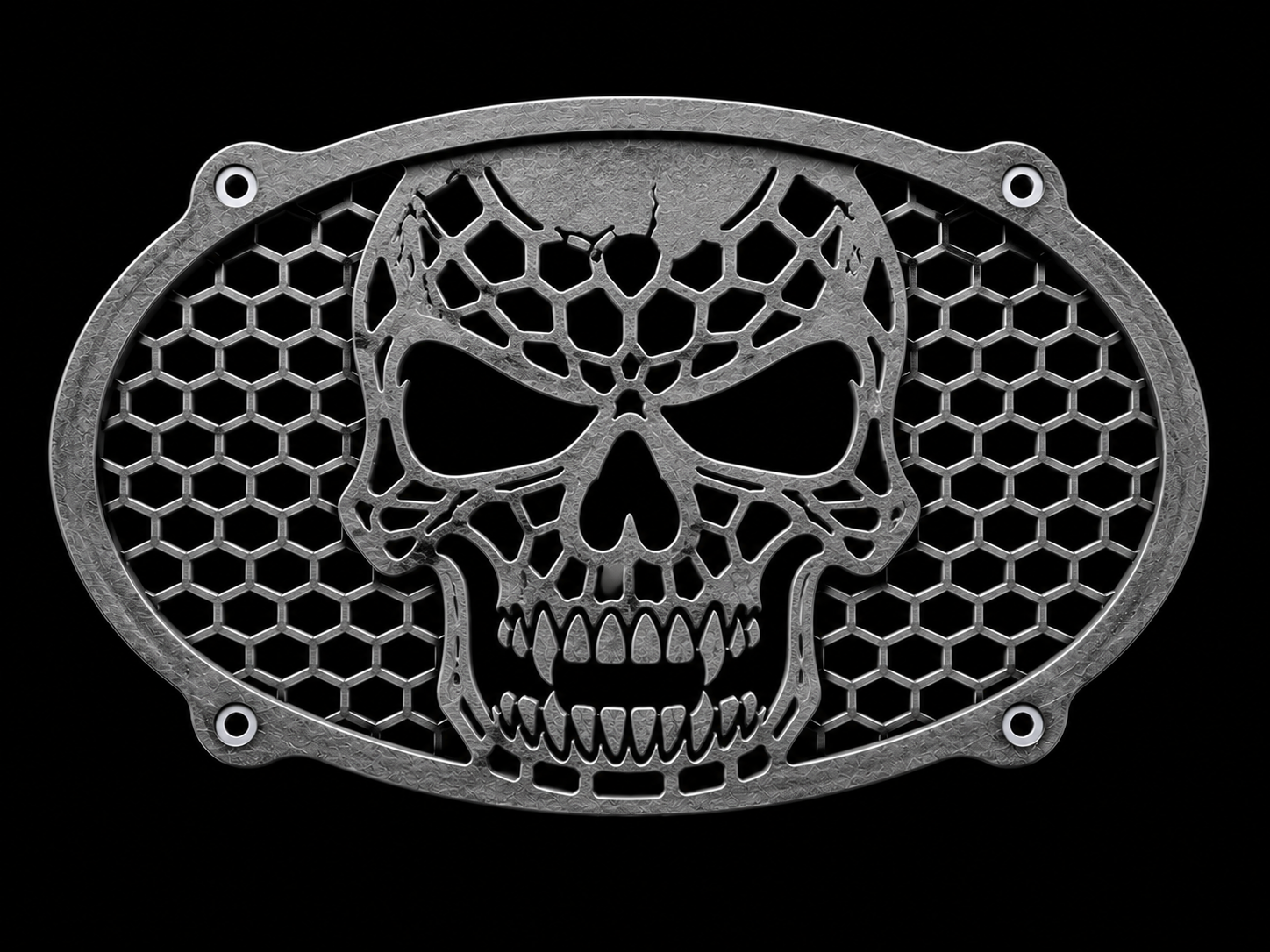 Metal vent cover with a skull design and honeycomb pattern, set against a black background.