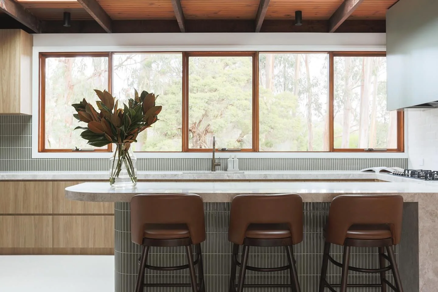 A beautiful spot to sit and take in the treetop views. One of our favourite things about Willora is how every window frames the surrounding bush and greenery 

Joinery @vsk_joinery 
Stone @cdkstone 
Tiles @perinitiles 
Stools @thonetaustralia