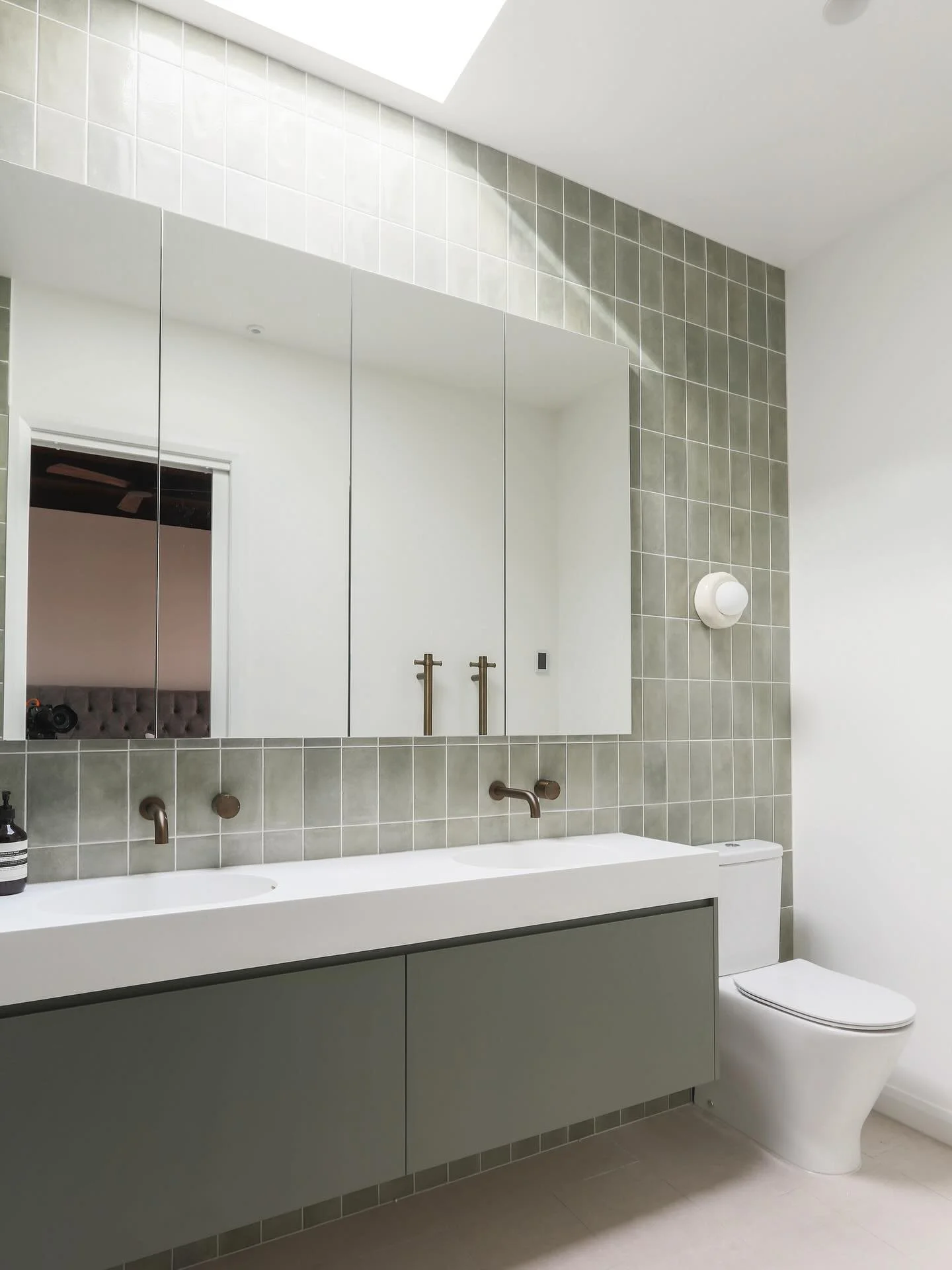 The ensuite make over at our Willora project included taking the room back to studs to add insulation and make a larger shower space. We added green tiles and joinery to tie in with the design theme of the home and antique brass tapware 💚 

Taps @ya