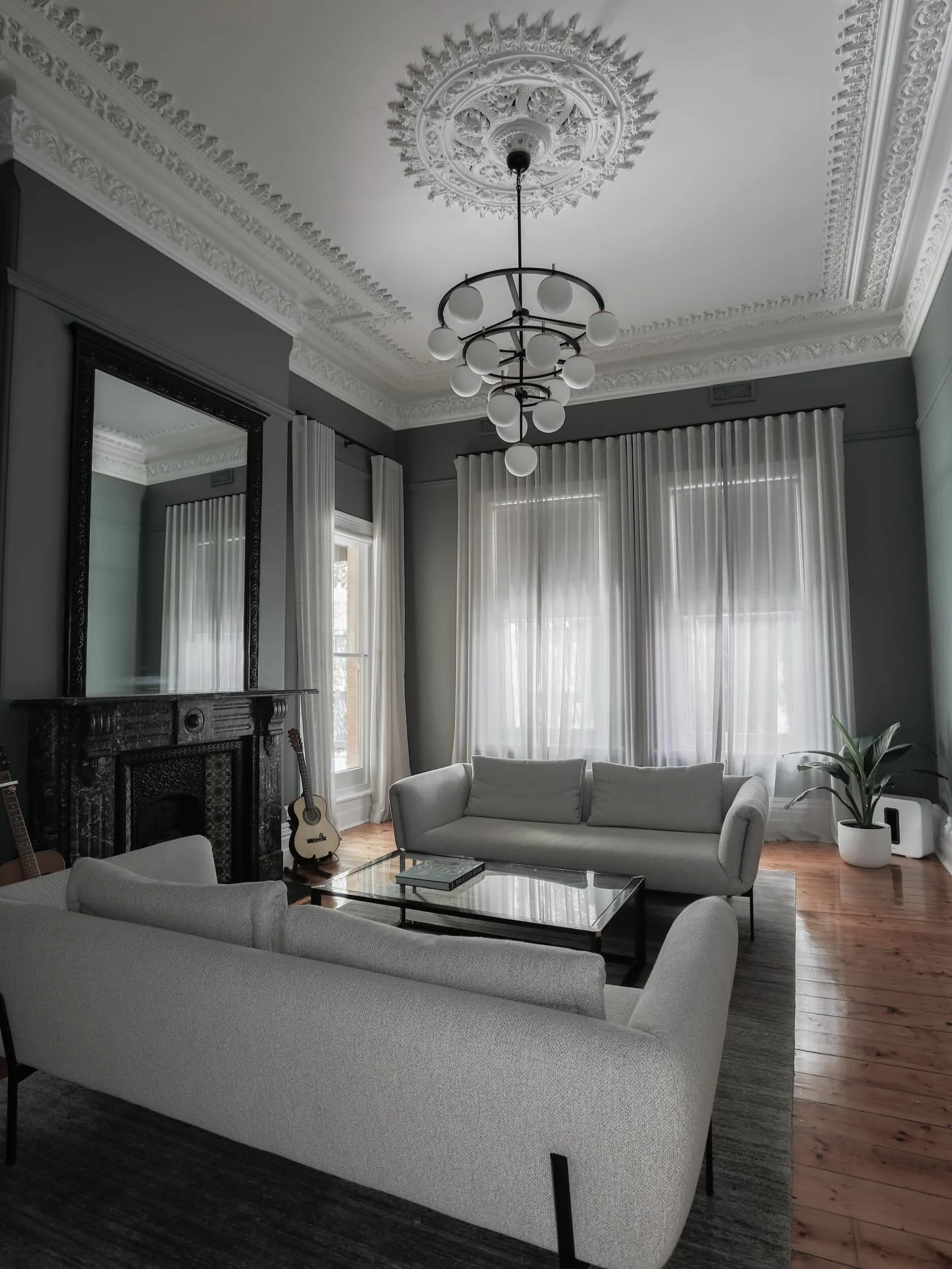 BEFORE &amp; AFTER / the formal lounge of our Windsor project has the most incredible 4m high ceilings. We used Dulux Bottle Green to give this room feel more moody and cozy vibe. A stunning custom rug by @armadilloandco and sofas by @collective_au f