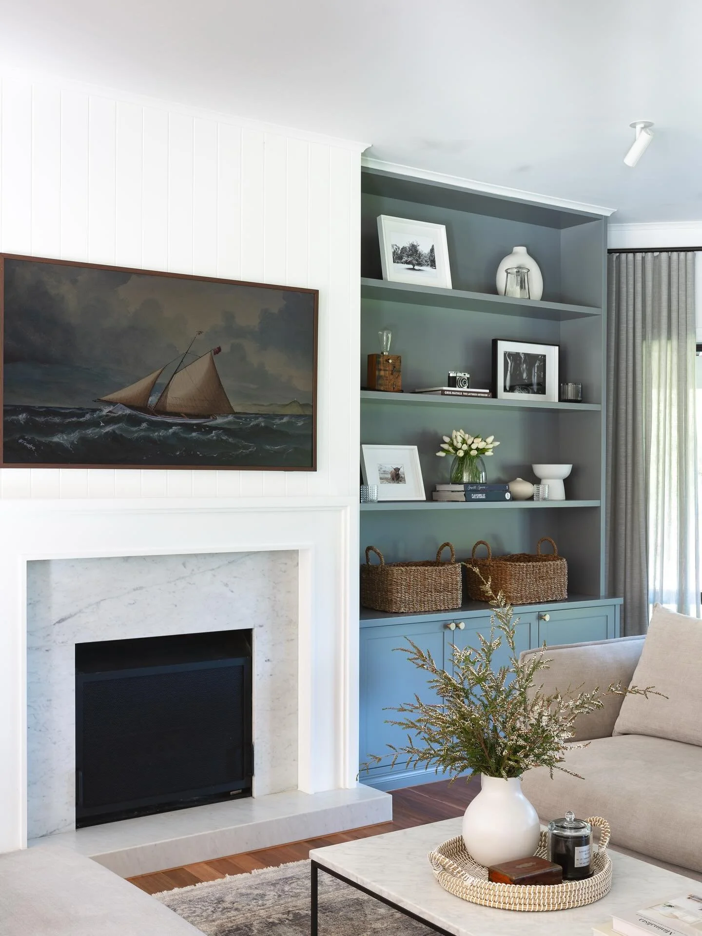 OAKLANDS // 

Flick through to see the evolution of our Oaklands living room. To create a more balanced and refined feel in this space, we removed the small window to the right and designed the built-in joinery symmetrically, allowing the fireplace t