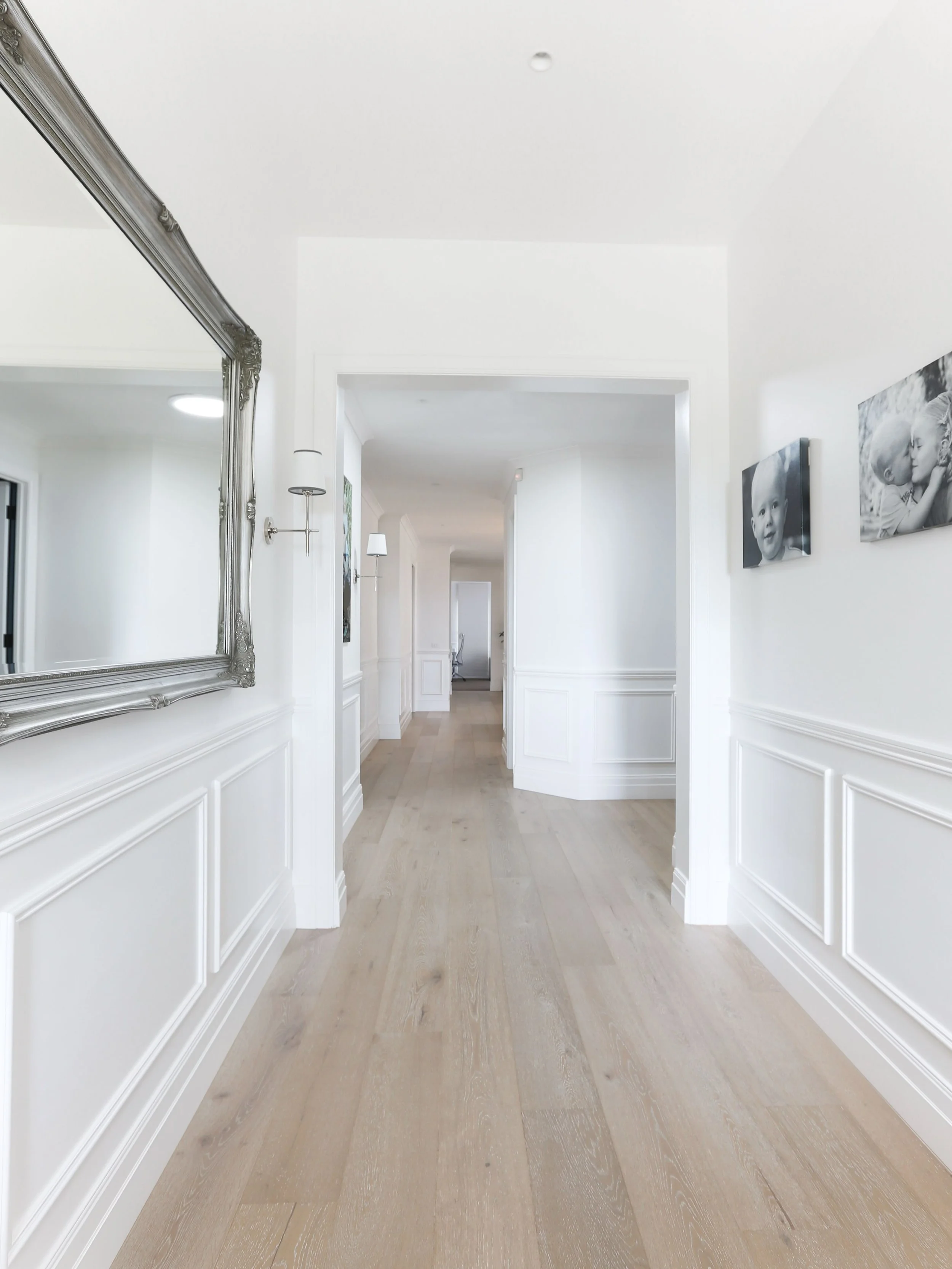 CREATING AN ENTRANCE! We gave this original early 2000s home in Mount Martha some much needed character and warmth by replacing the grey tile floors with timber boards, adding some wainscoting to the walls and replacing the door with some glass to le
