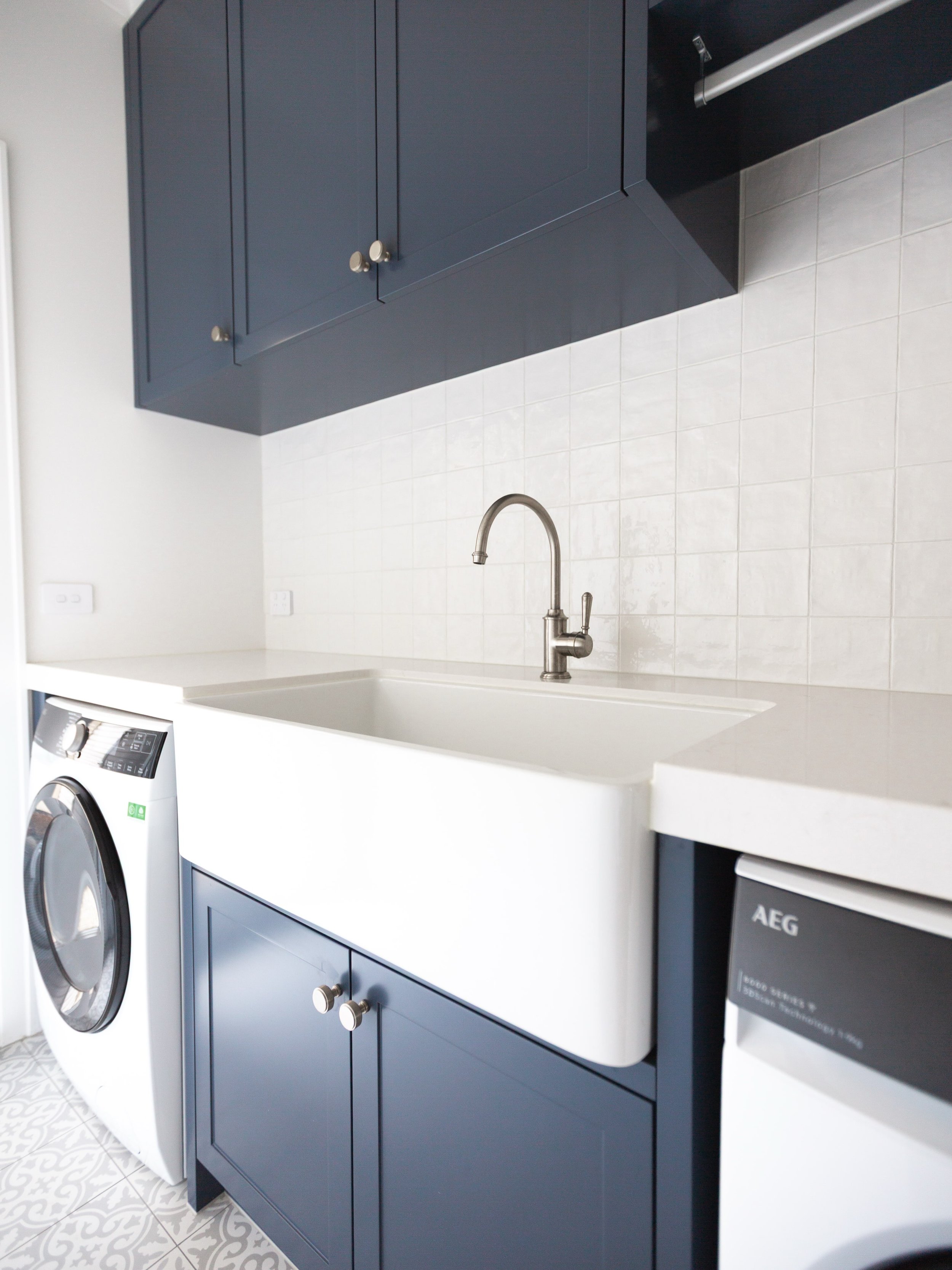 MOUNT MARTHA / A hardworking space, made beautiful. Deep blue joinery in Dulux Blue Steel, with Zellige tiles and timeless details bringing character to this light-filled laundry. A reminder that even the most practical rooms deserve thoughtful desig