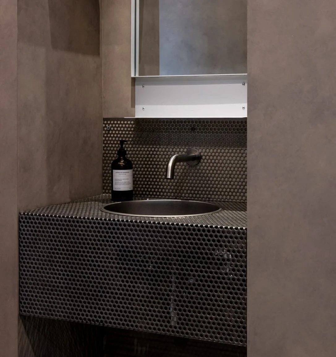 Folded perforated steel forms this communal hand basin in a recent commercial fit out. We thought about a standard stainless plate but instead pushed the boundaries to see how we could add more interest. Rogue but there was a vision. Big thanks to ou