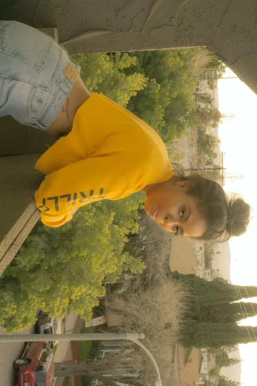 woman outdoors wearing yellow hoodie natural light portrait photography Los Angeles