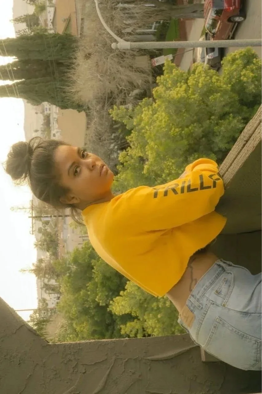 woman outdoors in greenery wearing yellow top lifestyle photography Los Angeles