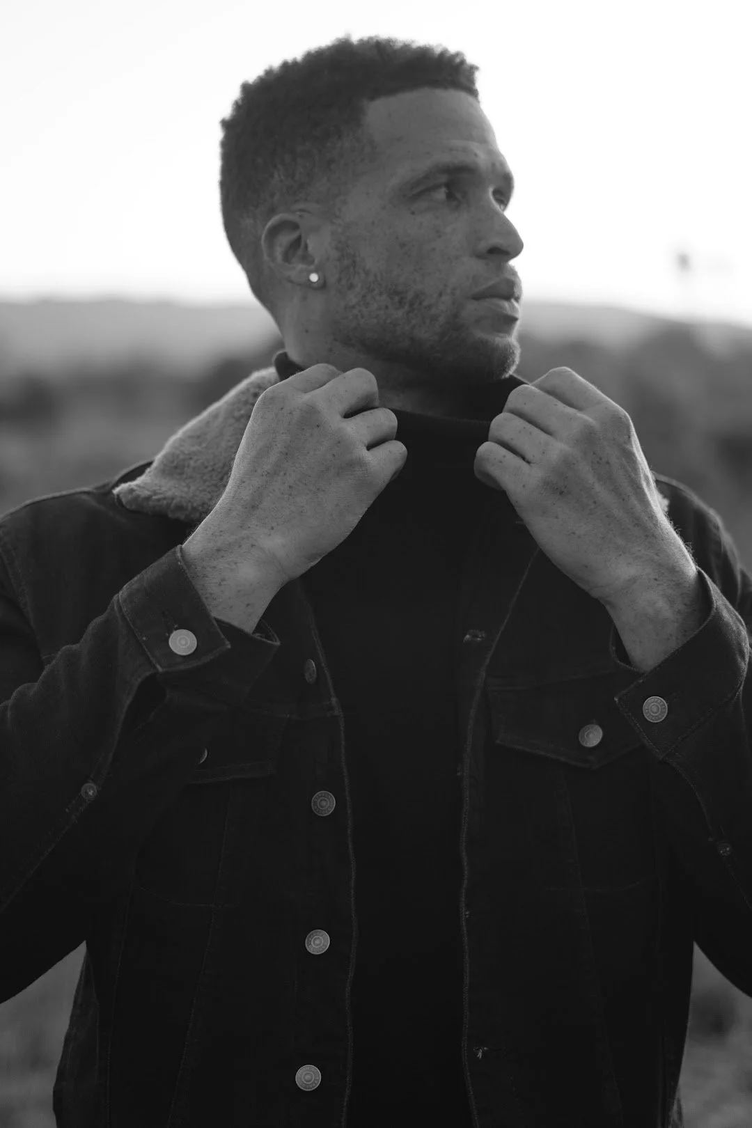 man adjusting jacket black and white editorial portrait photography Los Angeles