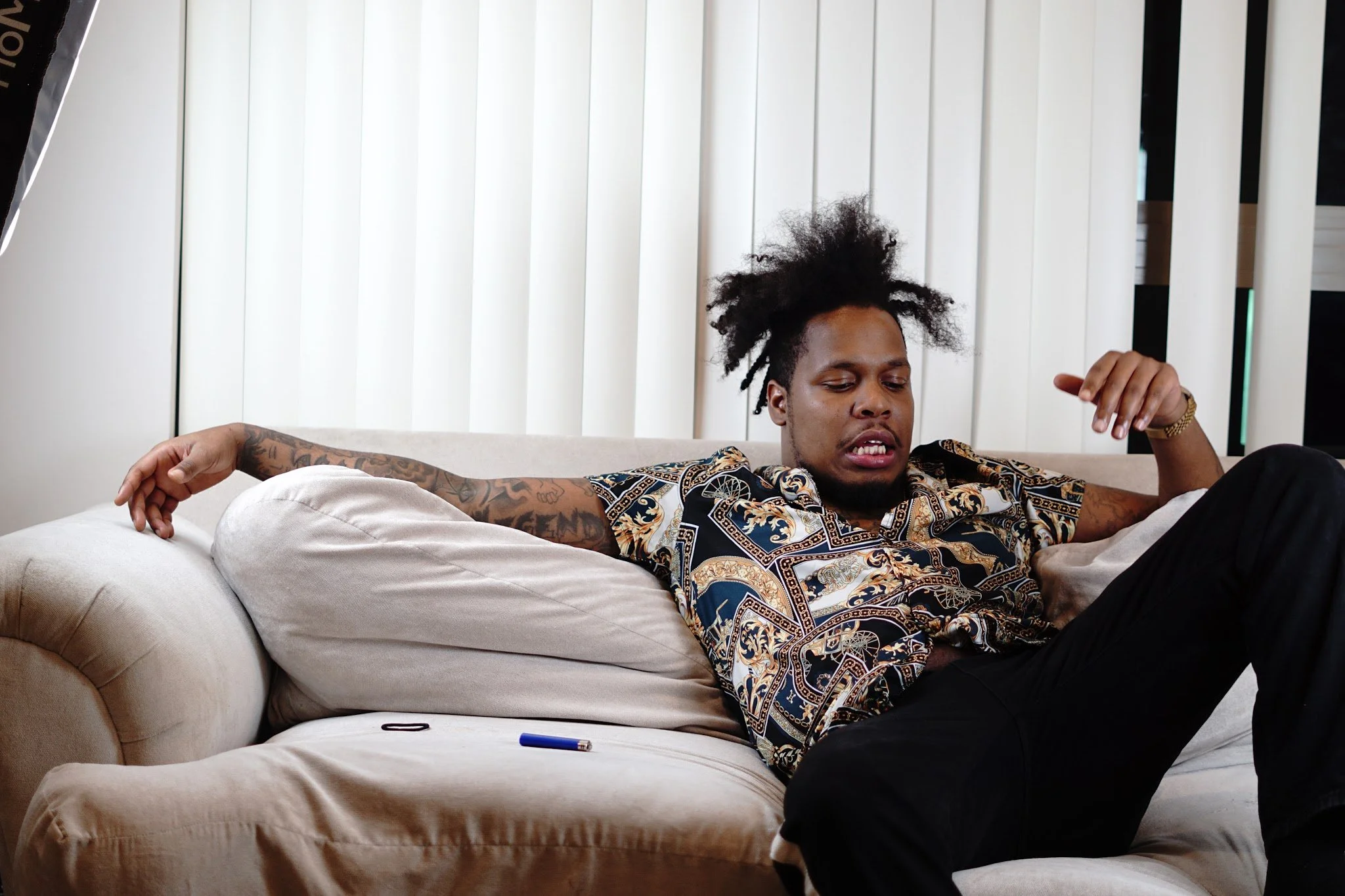 man sitting on couch relaxed lifestyle photography Los Angeles
