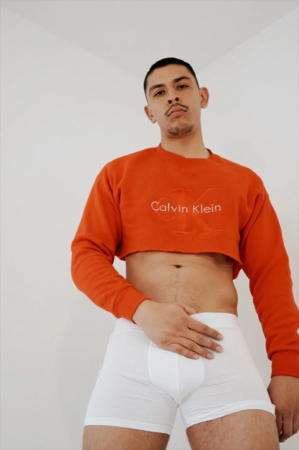 man wearing red Calvin Klein crop top sweater fashion portrait photography Los Angeles