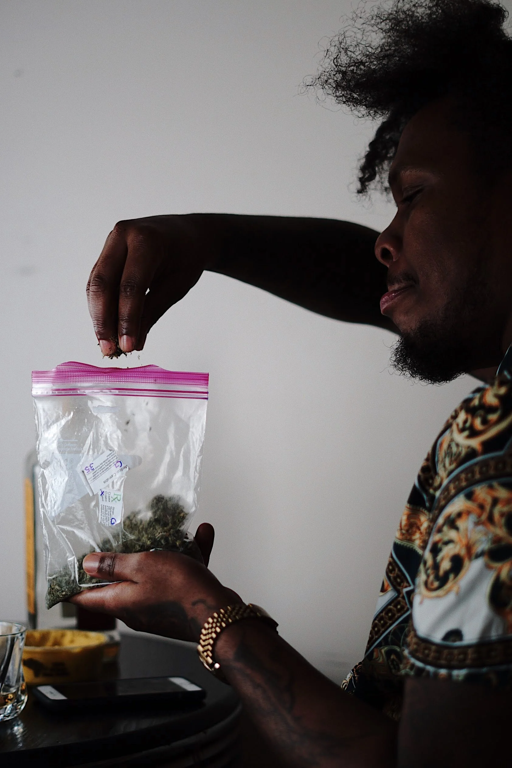 man sprinkling into bag lifestyle storytelling photography Los Angeles