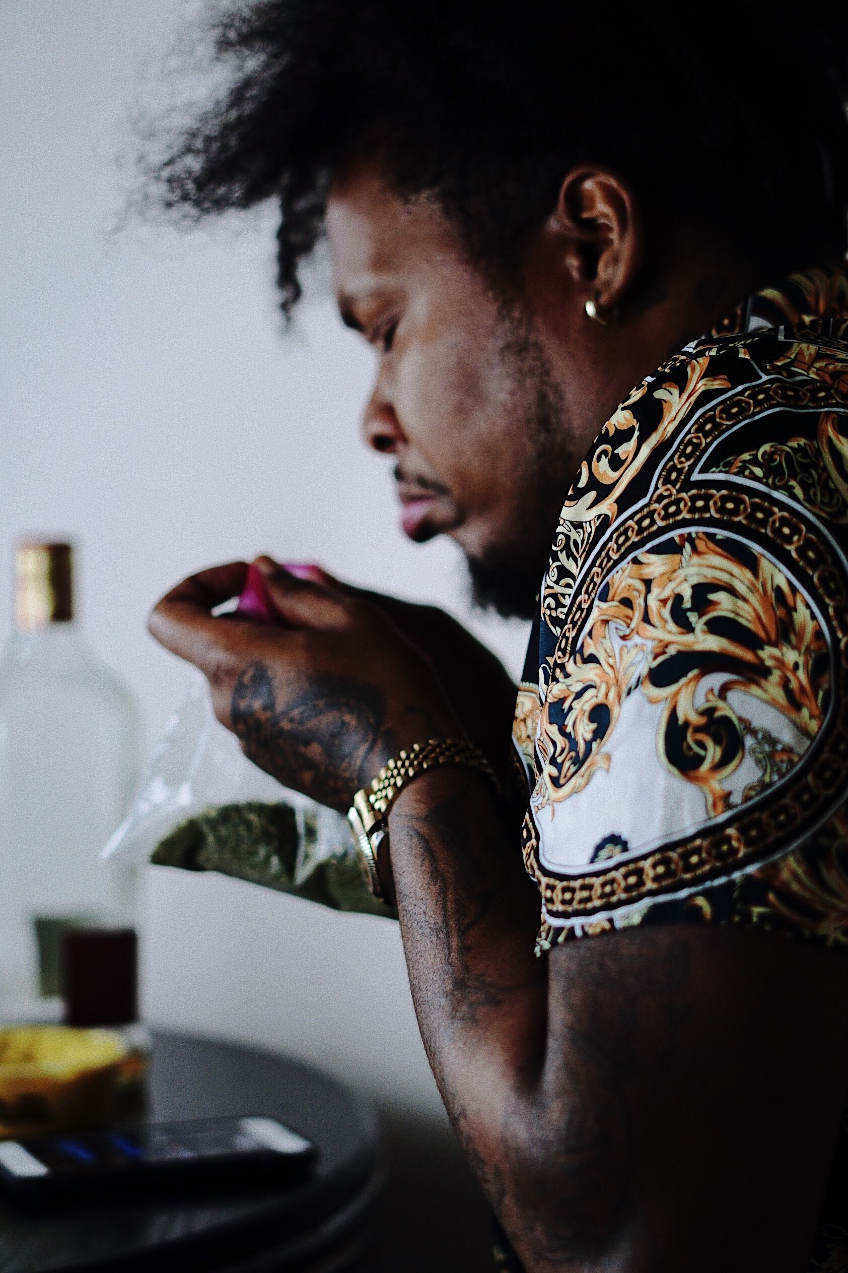 man smelling cannabis at table candid lifestyle photography Los Angeles