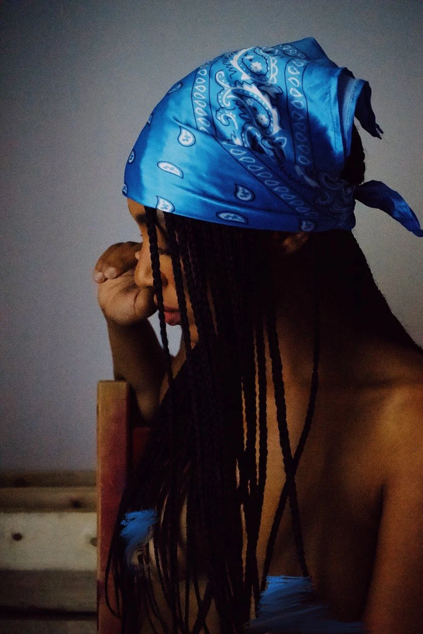 woman looking to the side wearing blue bandana soft light portrait photography Los Angeles