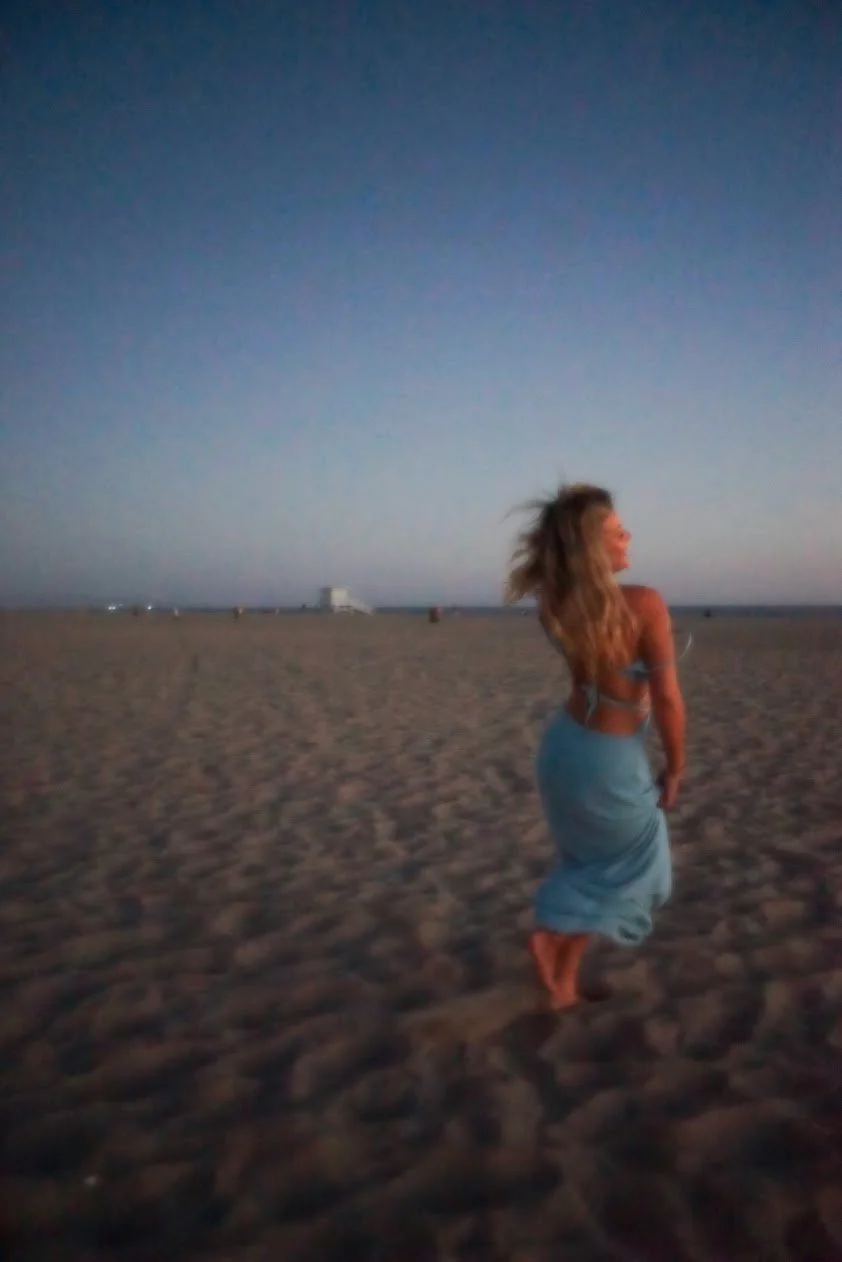 woman at beach with wind blowing hair cinematic lifestyle photography Los Angeles