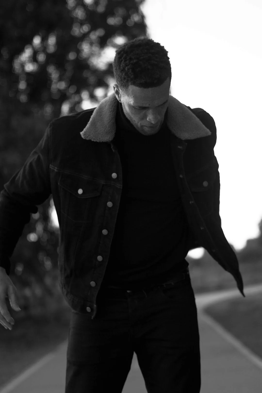 man looking down black and white moody portrait photography Los Angeles