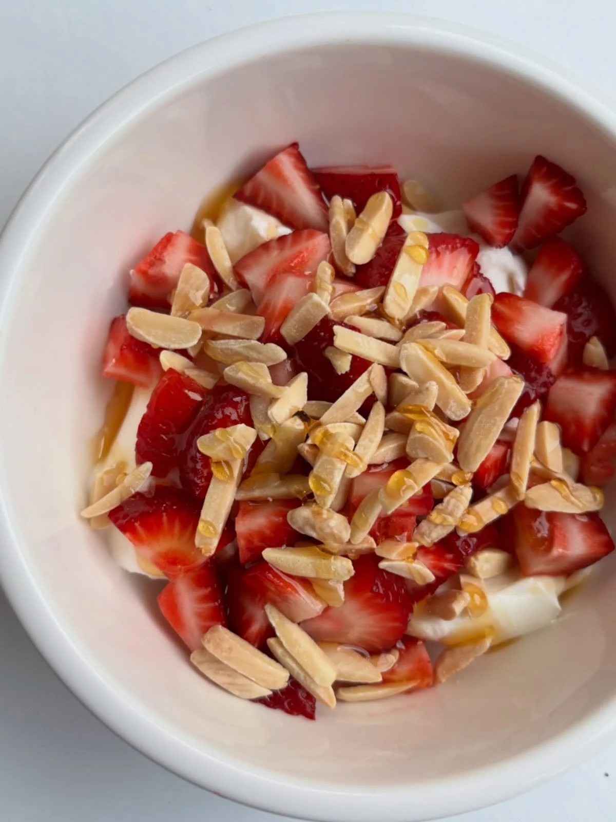 Greek yogurt + @hwy19produce strawberries + almonds + honey 😍