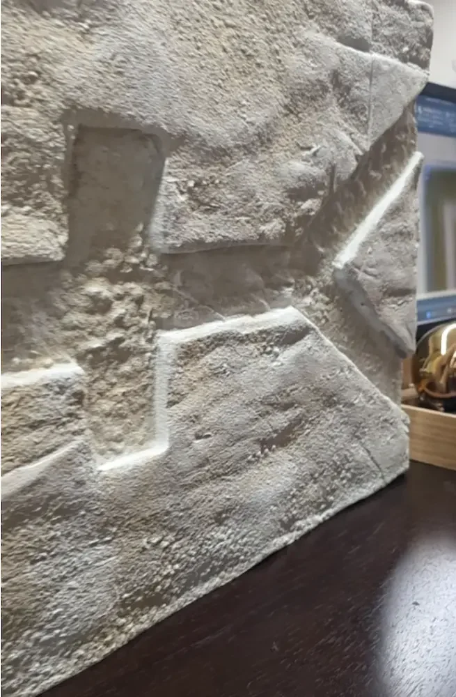 Handcrafted T-PILLAR console during production, featuring stone-like surfaces and symbolic carvings inspired by Göbeklitepe.
