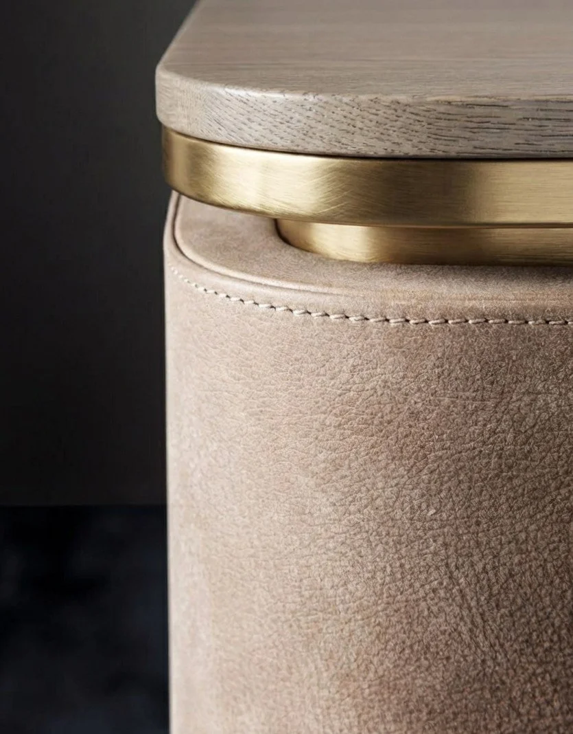 Luxury sculptural wine cabinet detail with solid wood top, brushed brass band and handcrafted suede-textured surface – Creative Ateliers