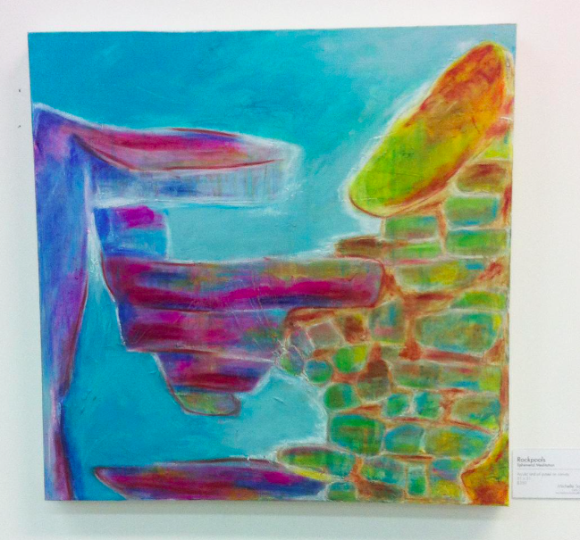 Abstract colorful painting of a landscape by Michelle Saleeba with a large rock formation, small trees, and water or a pool.