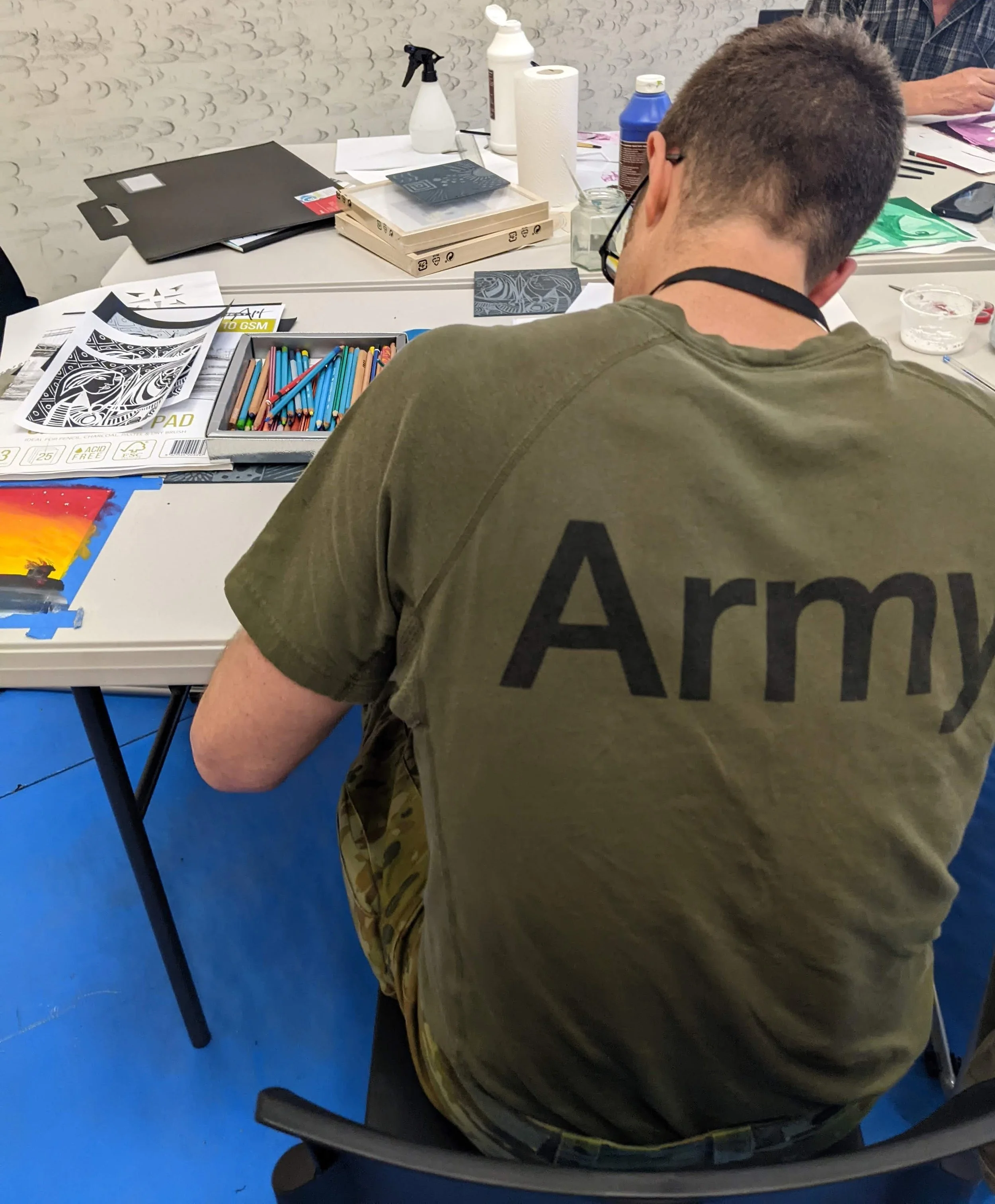 Australian Army personnel engaged in reflective artmaking as part of an arts in health program at Irwin Barracks