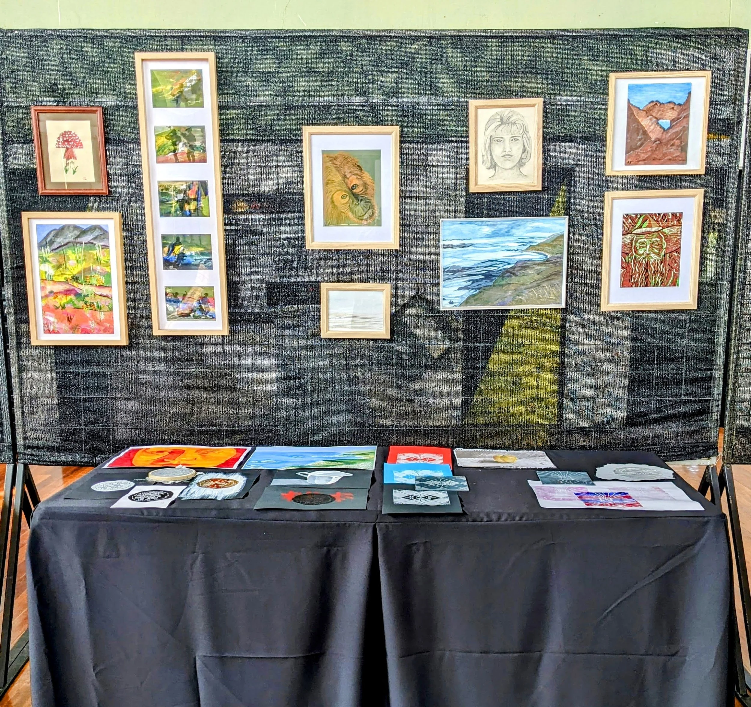 Artworks created through an Australian Army based arts engagement program at Irwin Barracks displayed in an exhibition setting