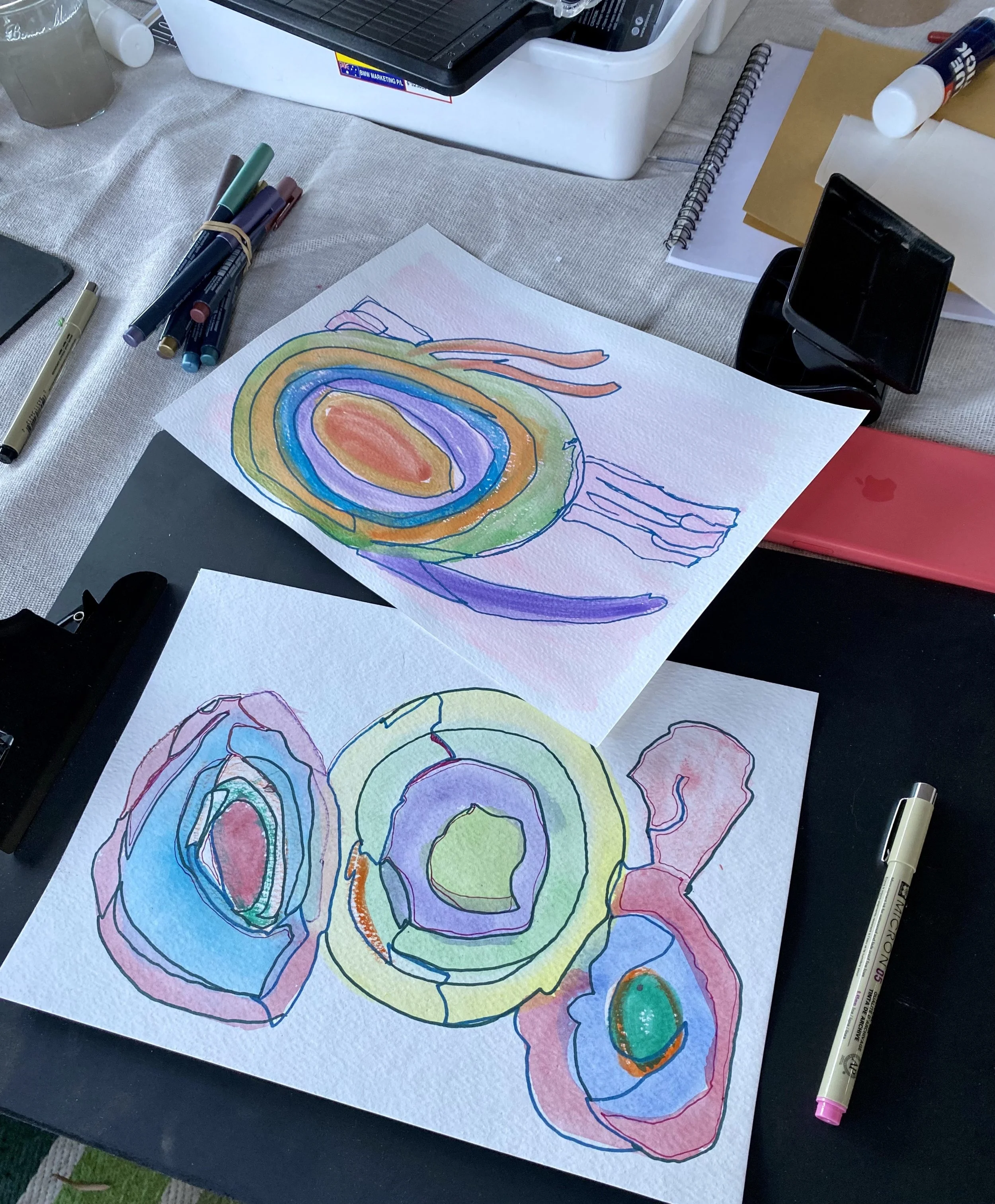Art works laid out for a therapeutic arts program in a community setting