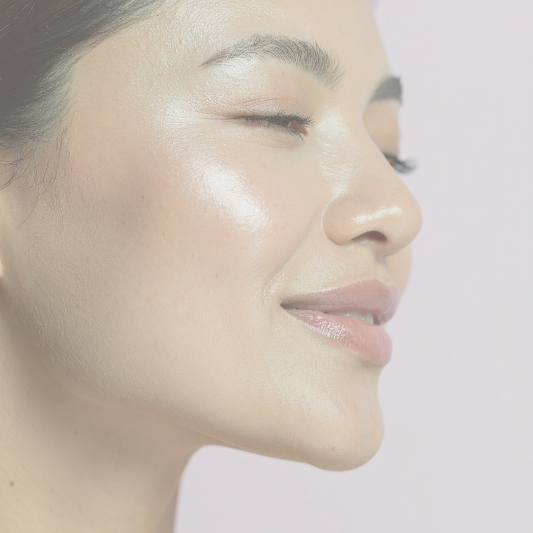 Woman smiling with glowing skin after skin boosters in Harrogate