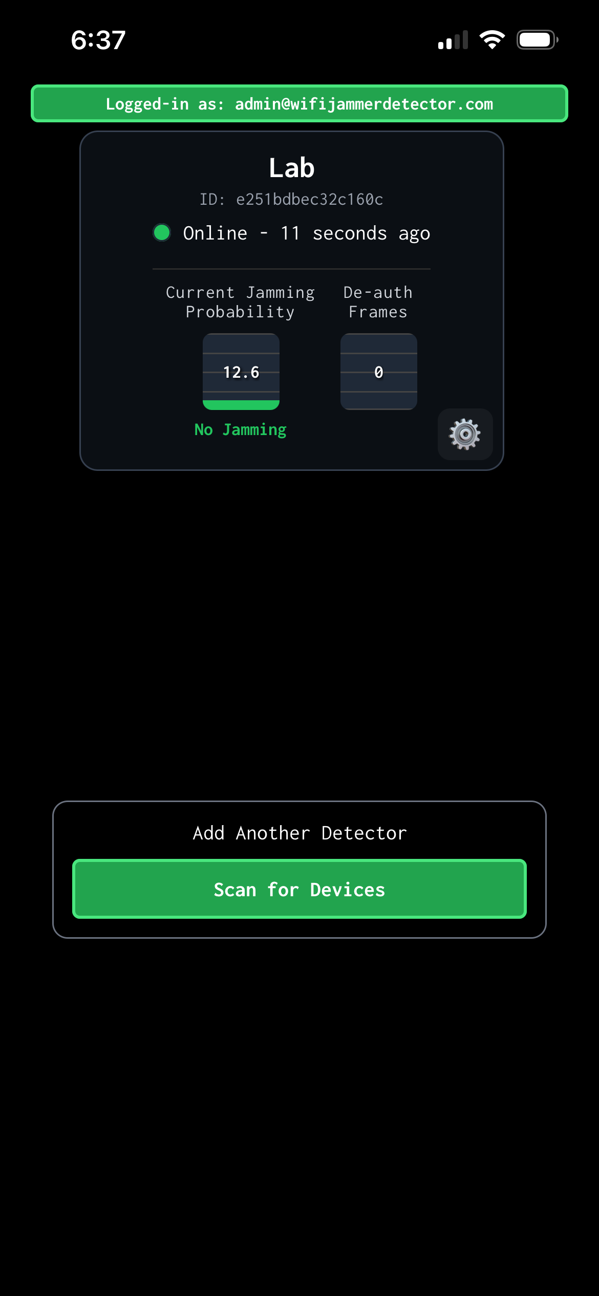 Mobile app screen showing a test device with online status and a current jamming probability of 13.7%, with options to add another detector or scan for devices, and a green header indicating the logged-in user.