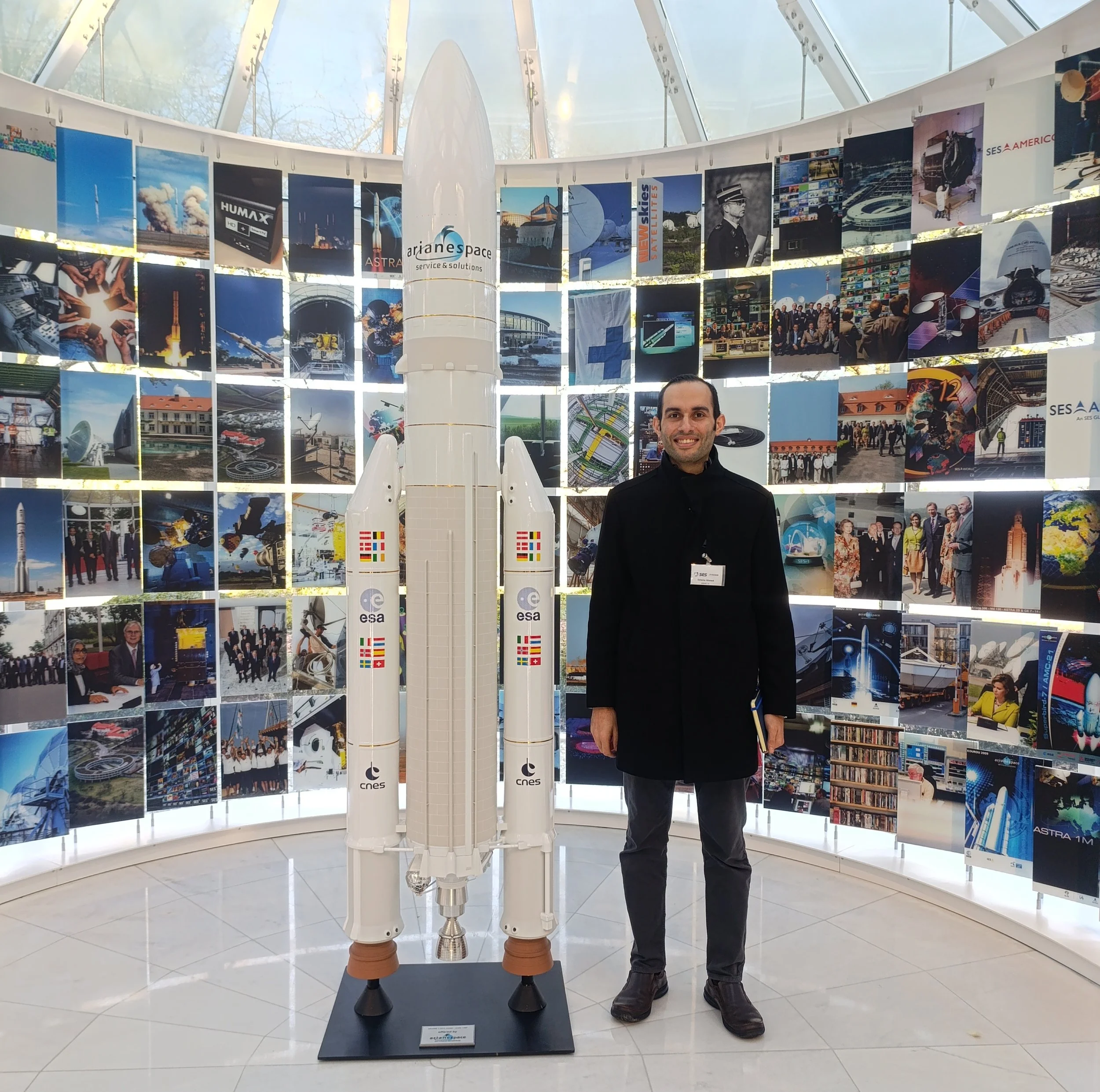 a display with multiple posters about space and science, including rockets and satellites