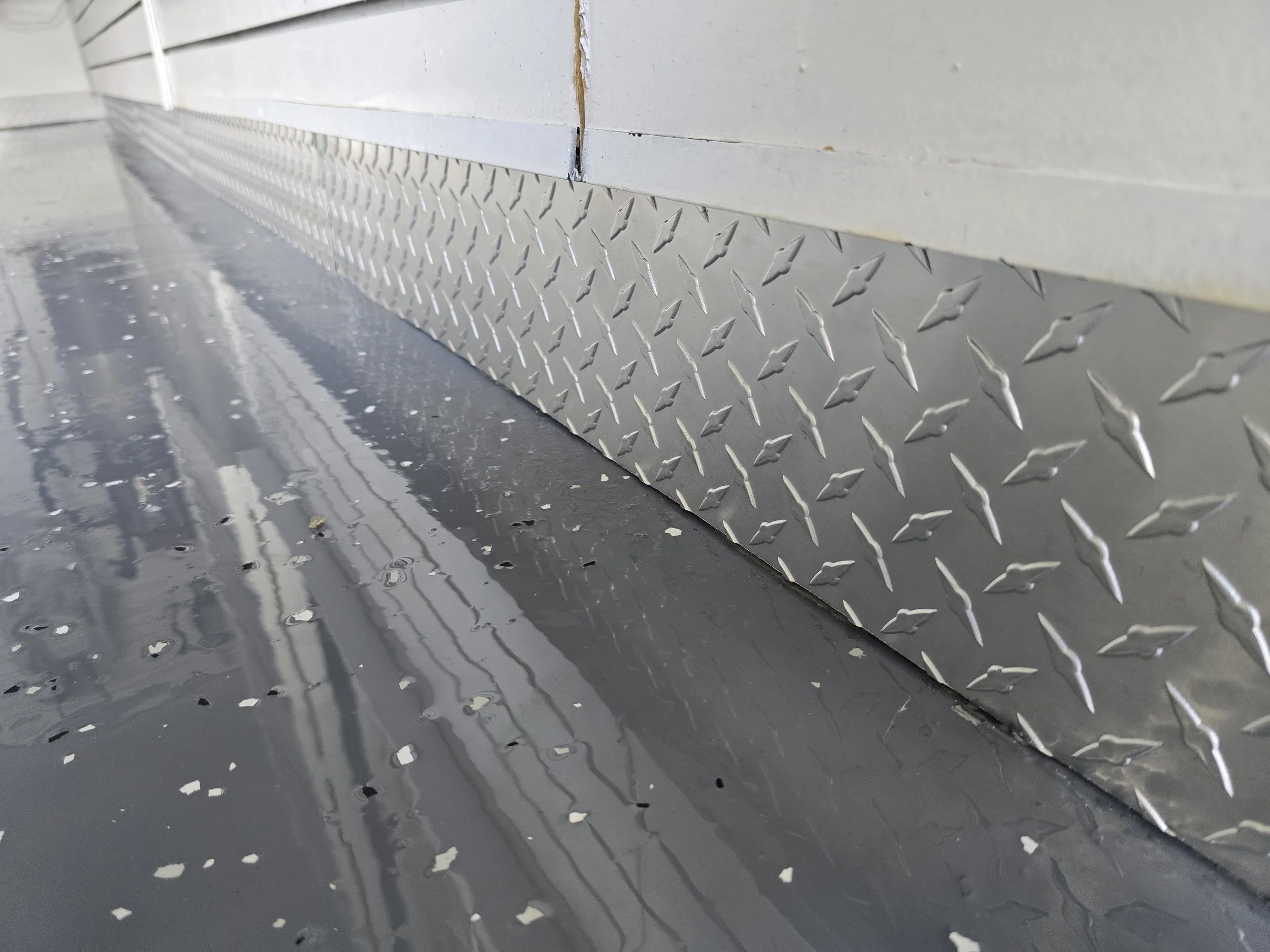 Metal trim and baseboard for garage