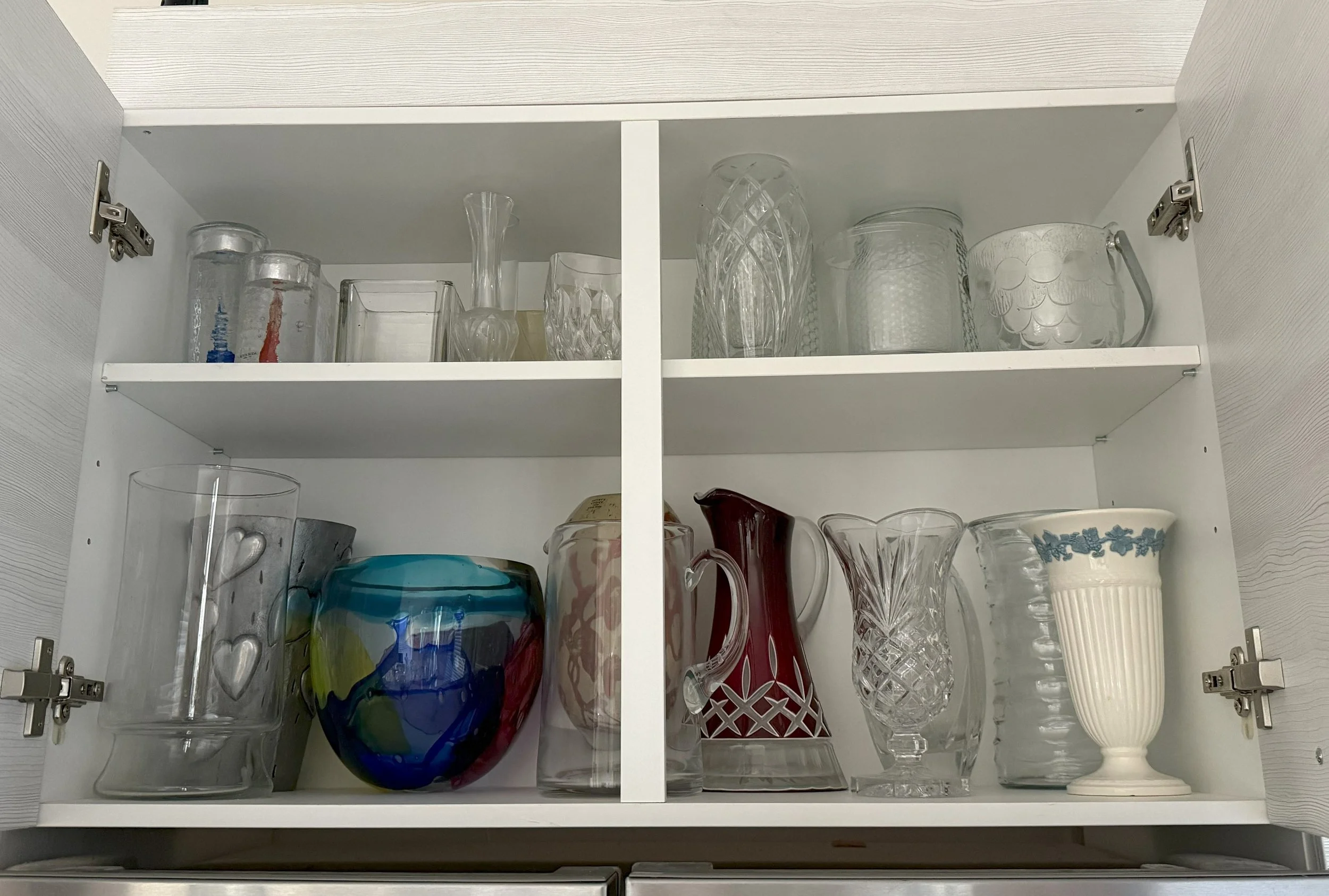 Above Refrigerator - After
Relocated entertainment items and moved less frequently used vases to top cabinet
