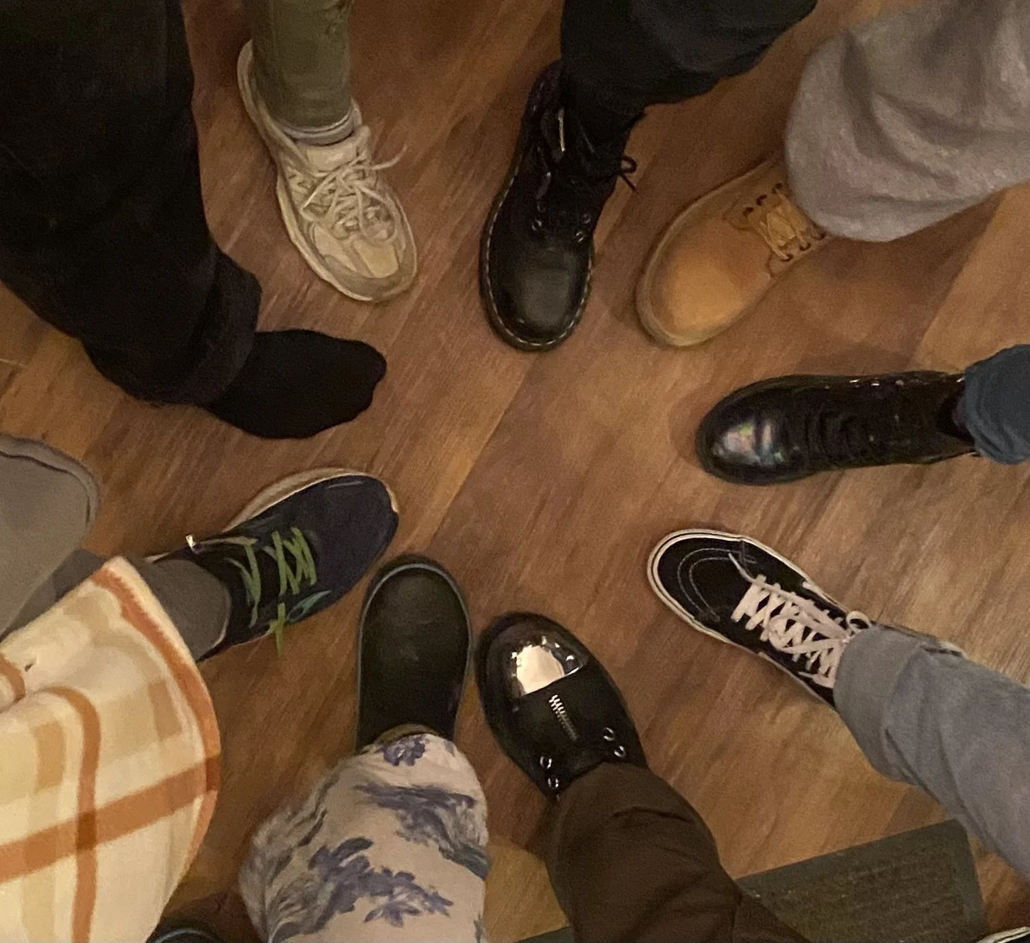 Photo 8 shoes all pointed toward each other in a star like shape