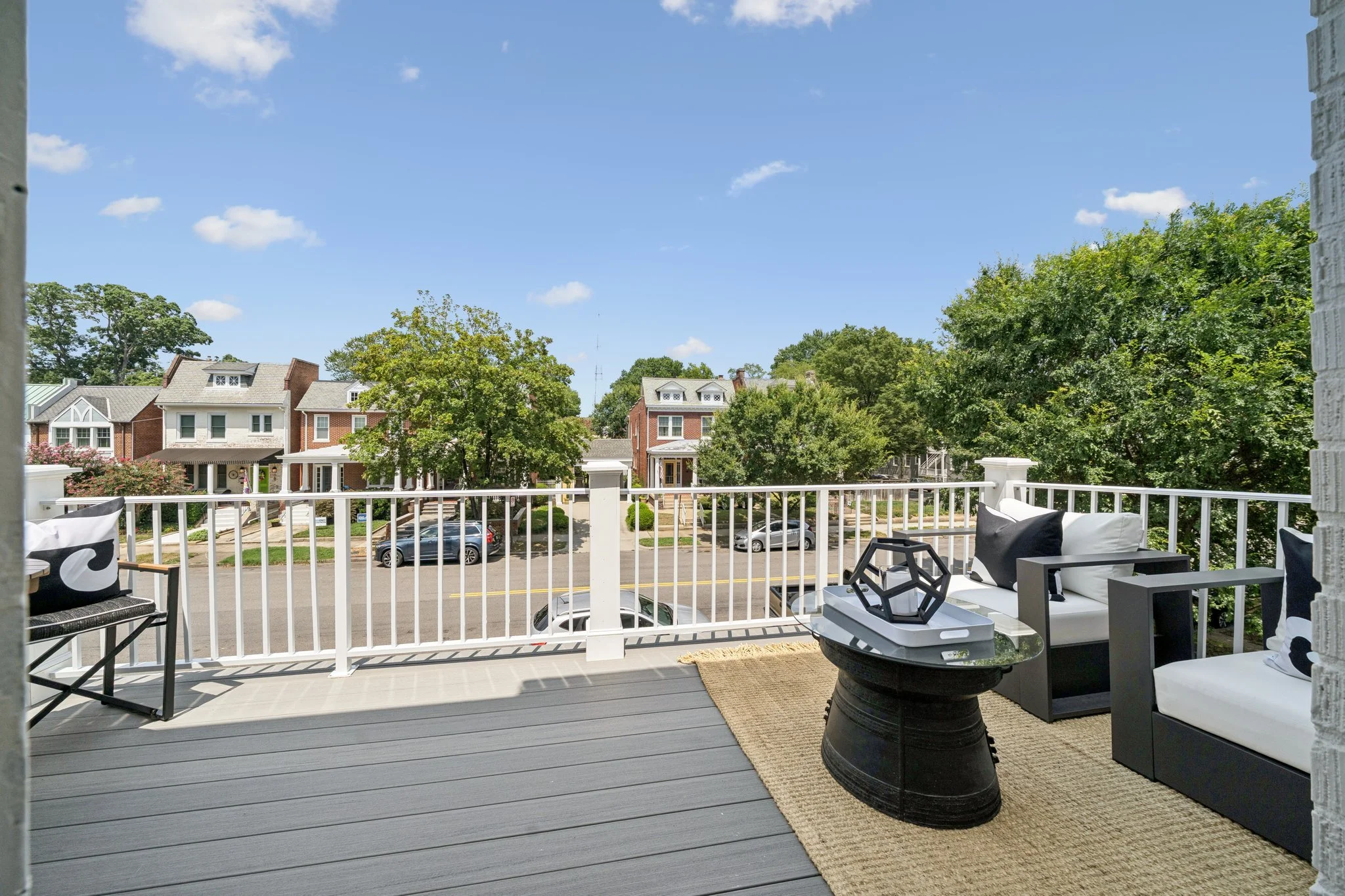 Upper terrace with lounge seating and views of Richmond’s historic homes.