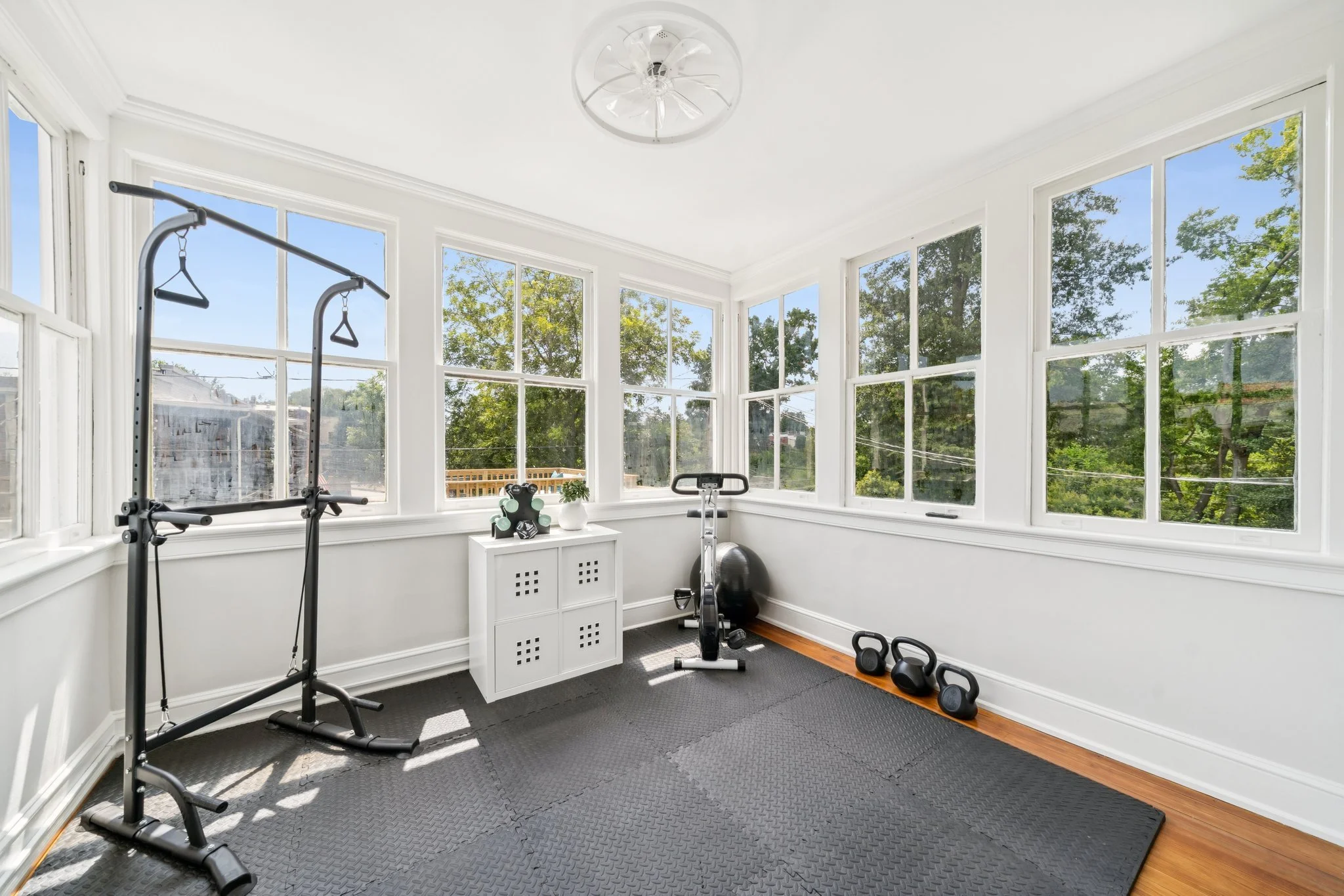 Home gym or flex room surrounded by windows and natural light.