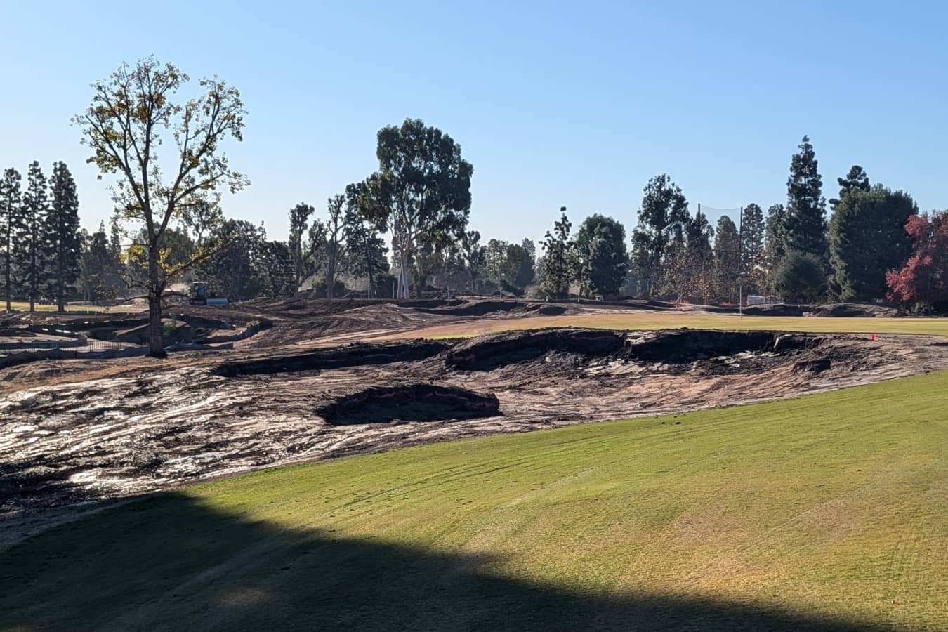 Wilshire Golf & Country Club under construction with large patches of disturbed soil and construction equipment.