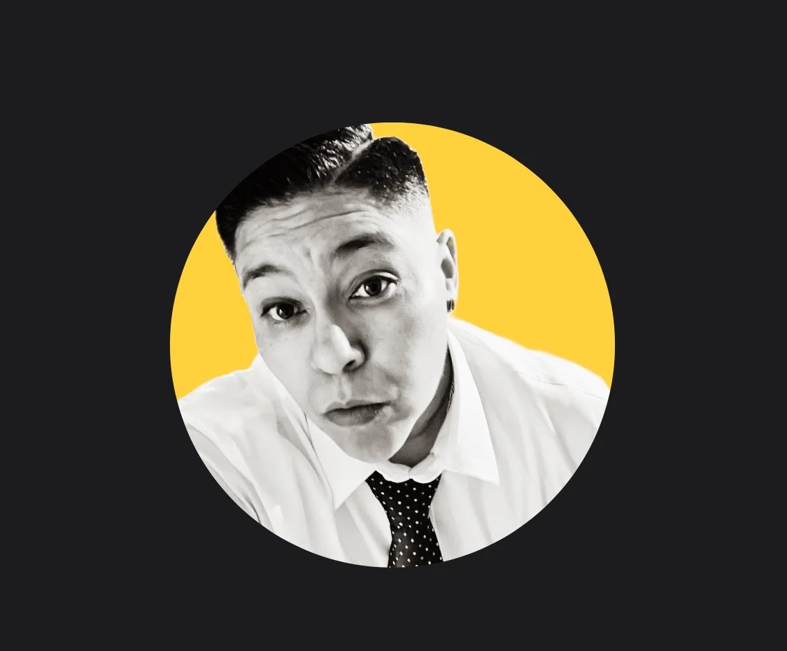 Black and white portrait of a person with short hair, wearing a white shirt and a polka dot tie, set against a yellow circle background.