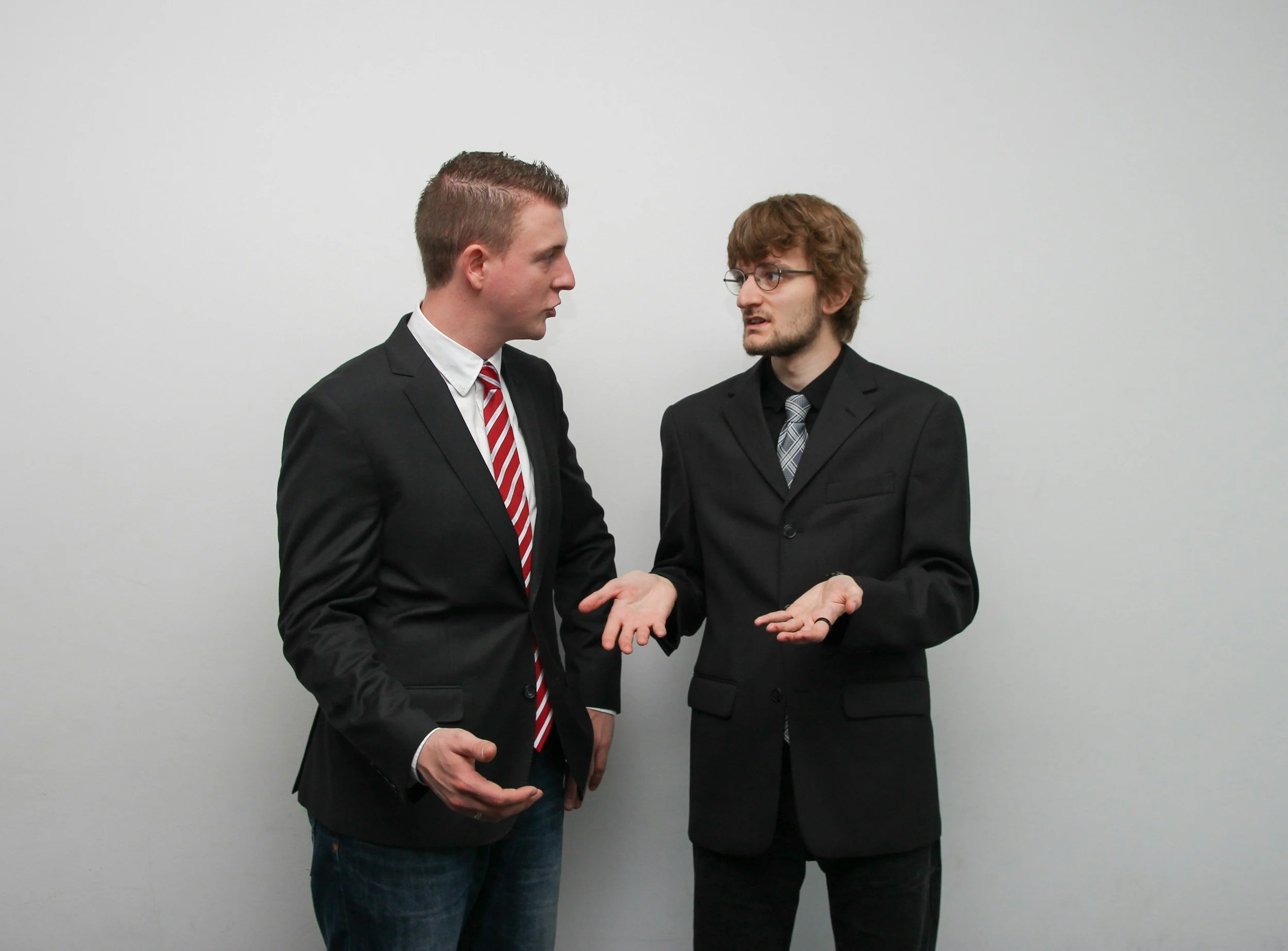 Two men in suits deciding
