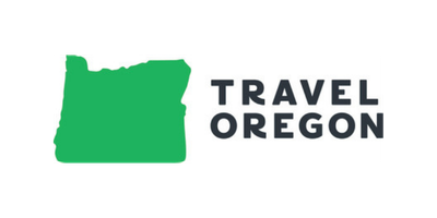 Logo for Travel Oregon featuring a green map outline of the state of Oregon with black and yellow text.