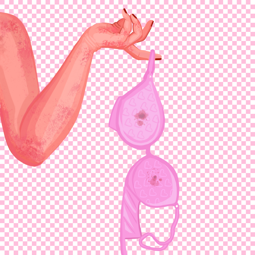 A hand holding a pink, heart-patterned balloon with a small dark stain on it, against a pink checkered background.